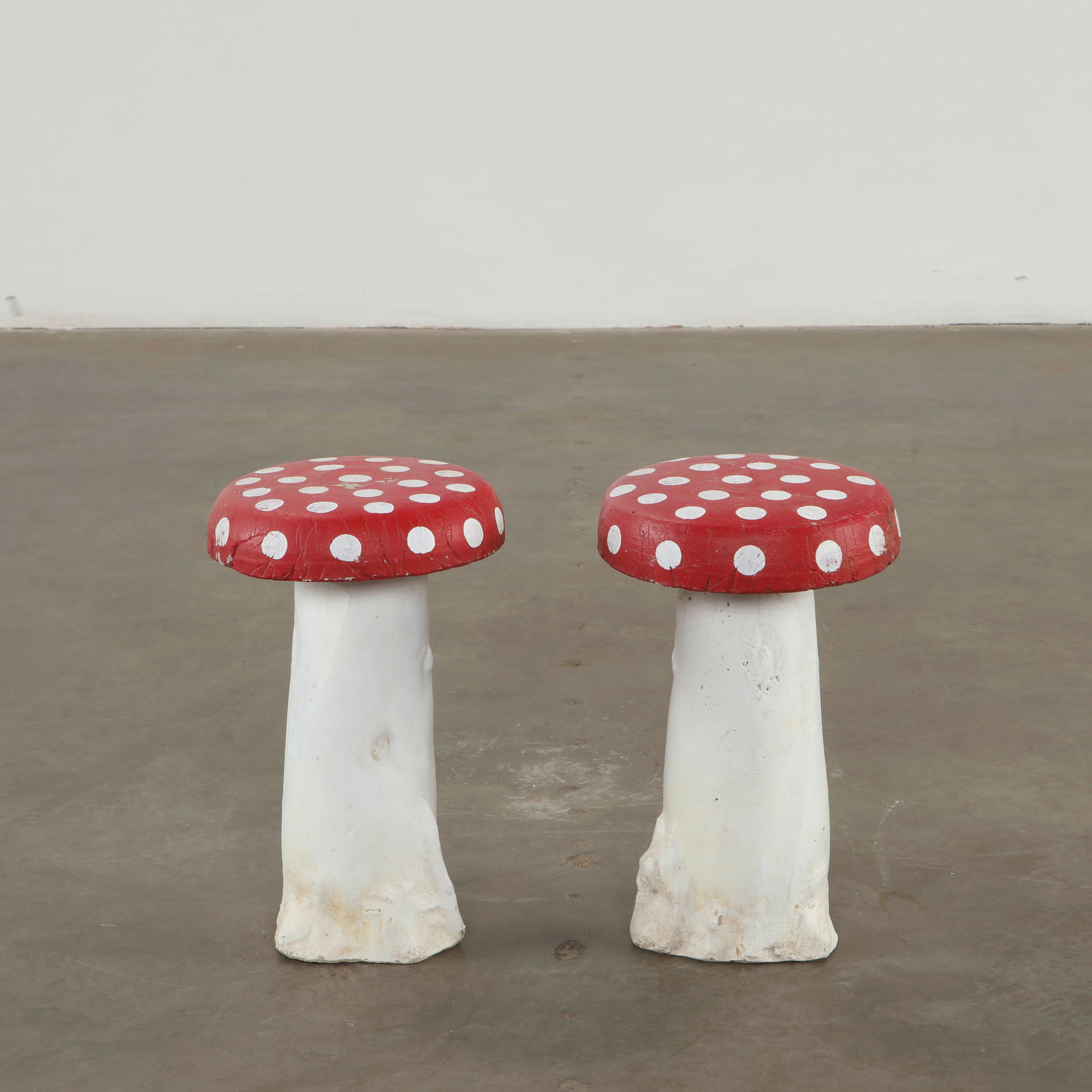 Pair of Concrete Mushroom Sculptures, 1960s: Whimsical concrete mushrooms crafted with playful proportions and vivid polychromy. Designed as decorative garden accents, they capture the imaginative spirit of mid-century outdoor ornamentation. Hei
