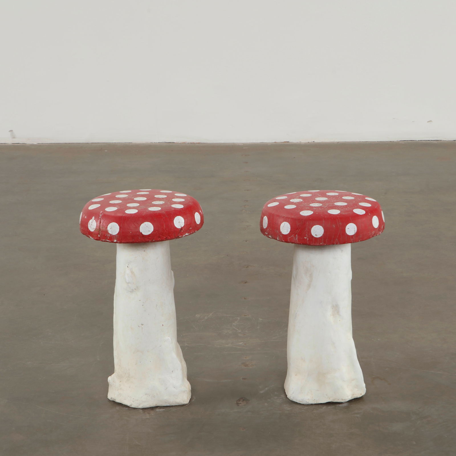 Pair of Concrete Mushroom Sculptures, 1960s: Whimsical concrete mushrooms crafted with playful proportions and vivid polychromy. Designed as decorative garden accents, they capture the imaginative spirit of mid-century outdoor ornamentation. Hei