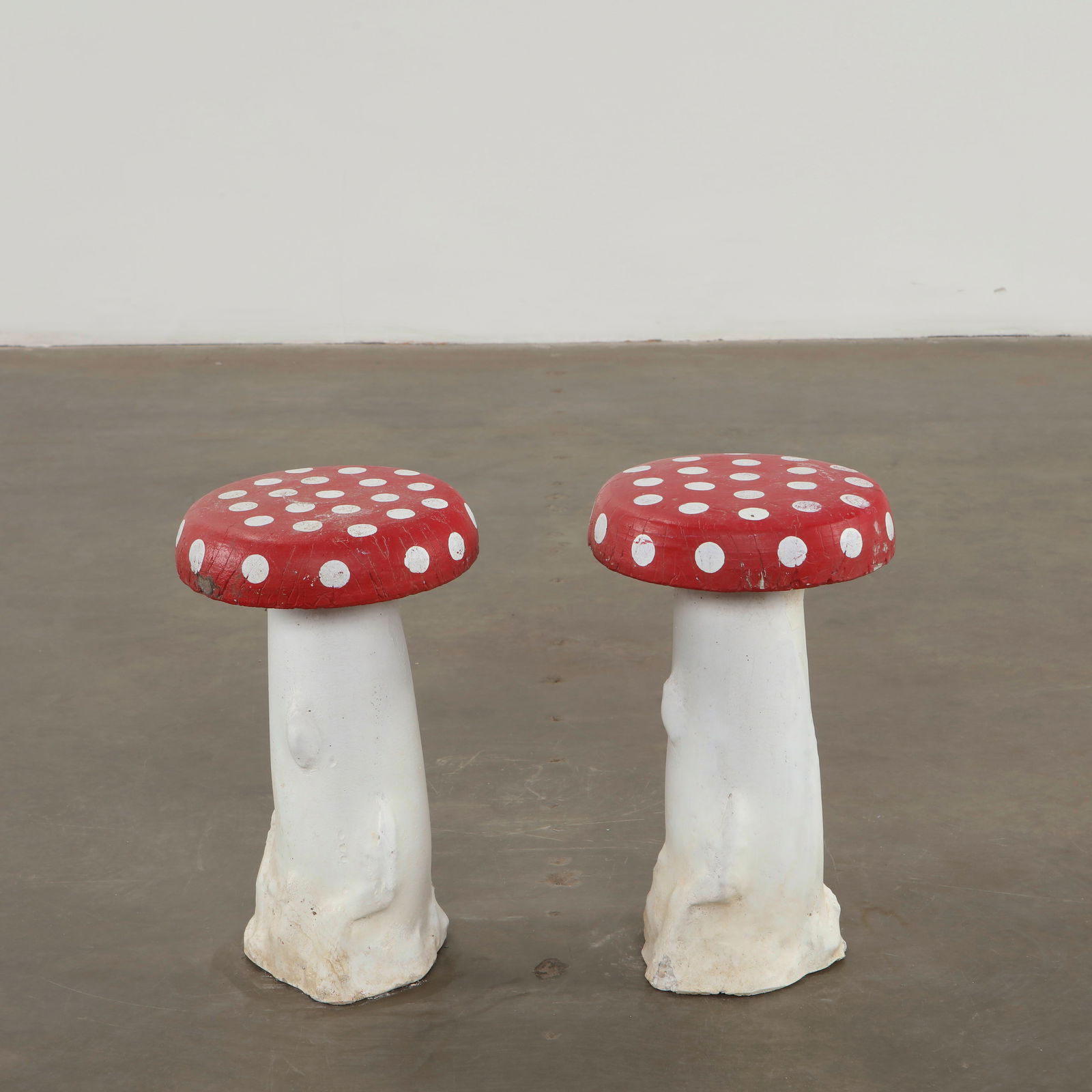 Pair of Concrete Mushroom Sculptures, 1960s: Whimsical concrete mushrooms crafted with playful proportions and vivid polychromy. Designed as decorative garden accents, they capture the imaginative spirit of mid-century outdoor ornamentation. Hei