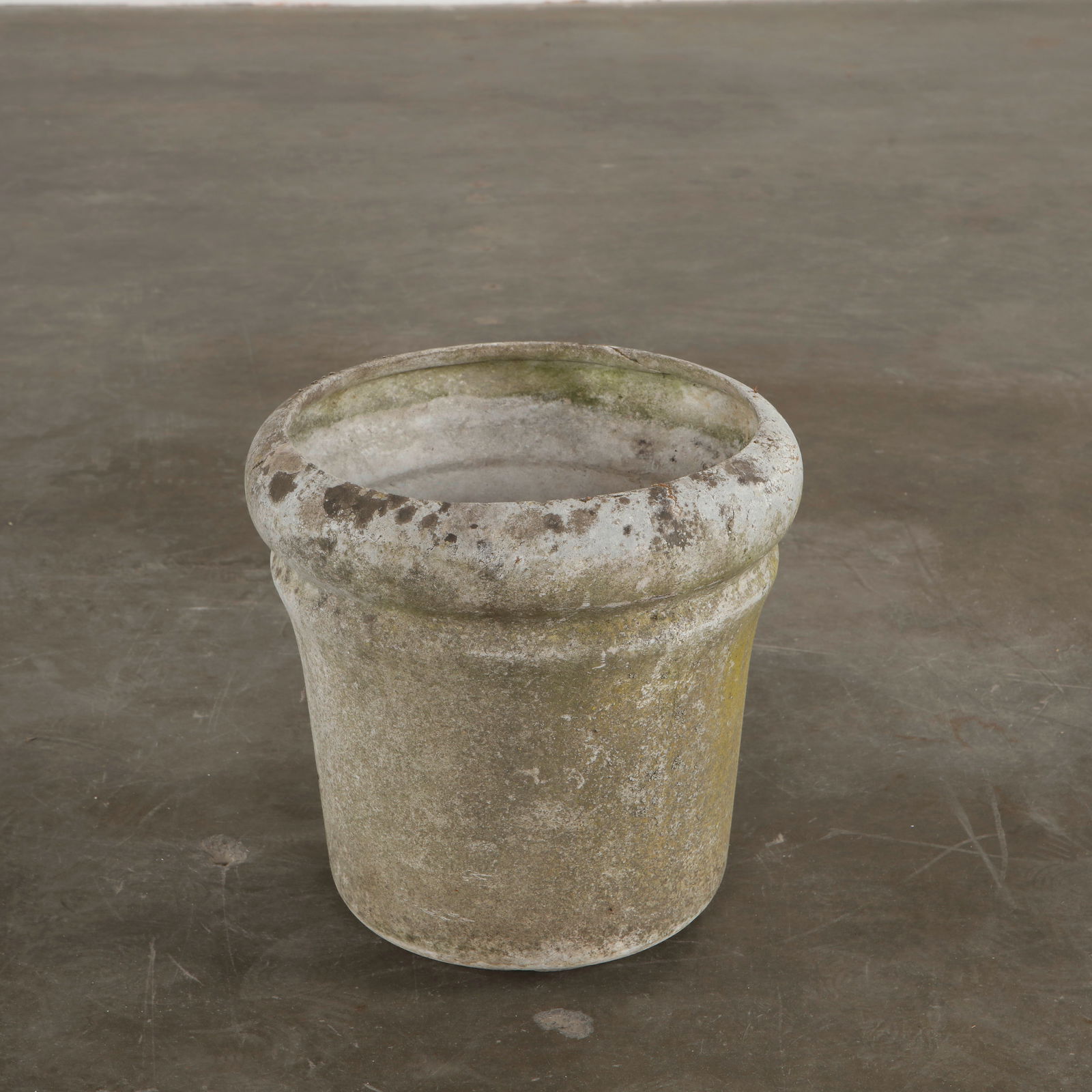 Willy Guhl, Round Planter, 1960s: Crafted in fiber cement with Guhl's signature rounded lip, this sculptural planter shows a beautifully weathered patina from decades outdoors. The form remains strong and stable, with surface markings