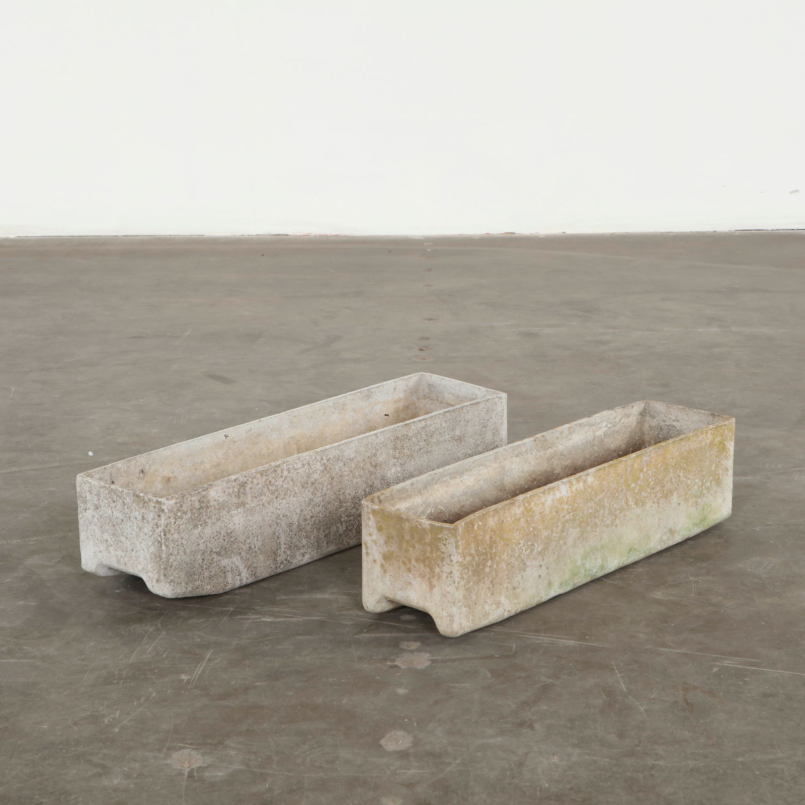 Willy Guhl, Pair of Rectangular Planters, 1960s: Classic rectangular Eternit planter designed by Willy Guhl. Timeless Swiss design with natural patina for outdoor use. Small: Height: 6 in. Width: 24 in. Depth: 6 in. Longer: Height: 6 in. Width: 26 i