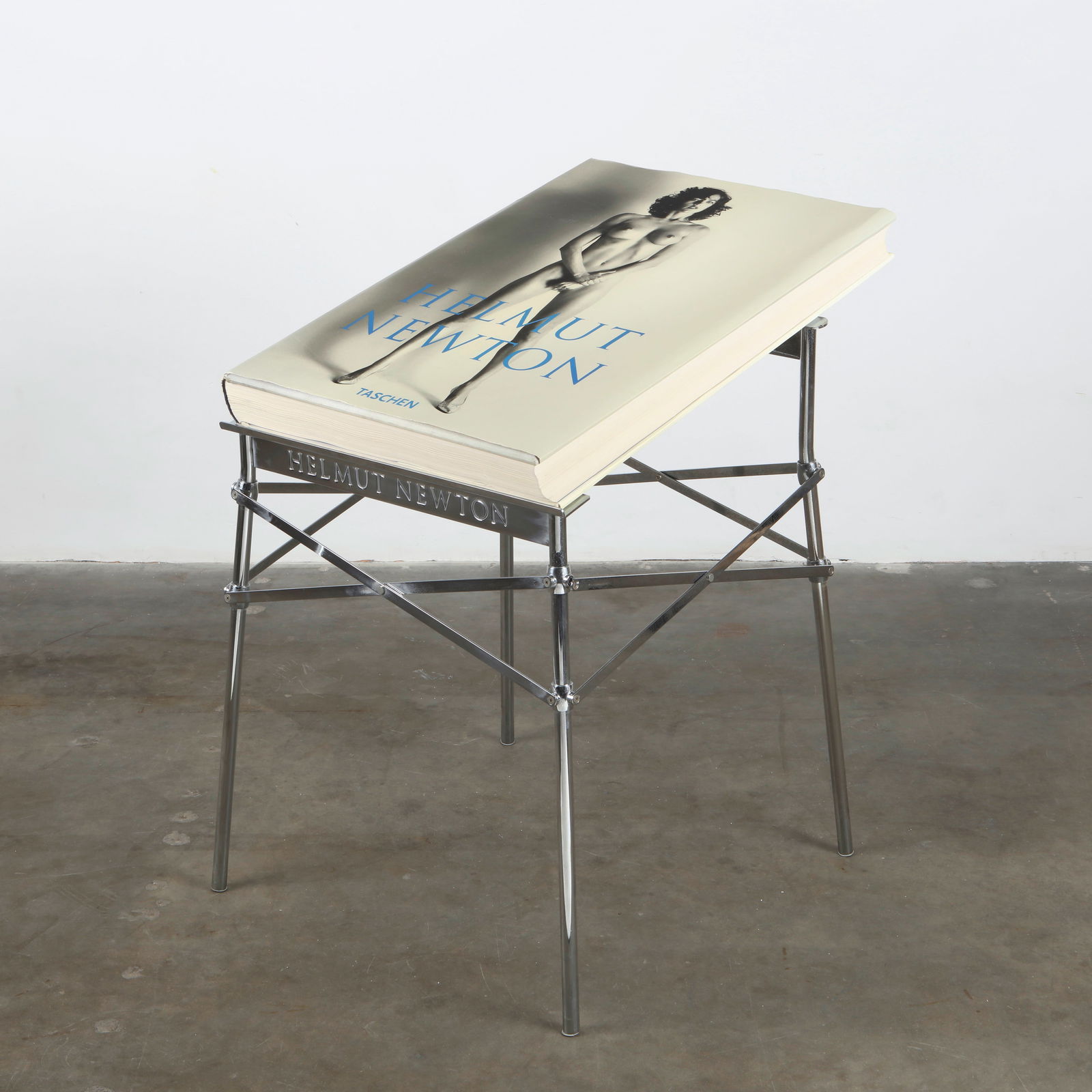 Helmut Newton, Sumo Book with Philippe Starck Stand, 1999: Published by Taschen in a limited edition of 10,000 copies, signed and numbered 00855 by Helmut Newton. The monumental volume is presented on its original polished metal stand designed by Philippe Sta