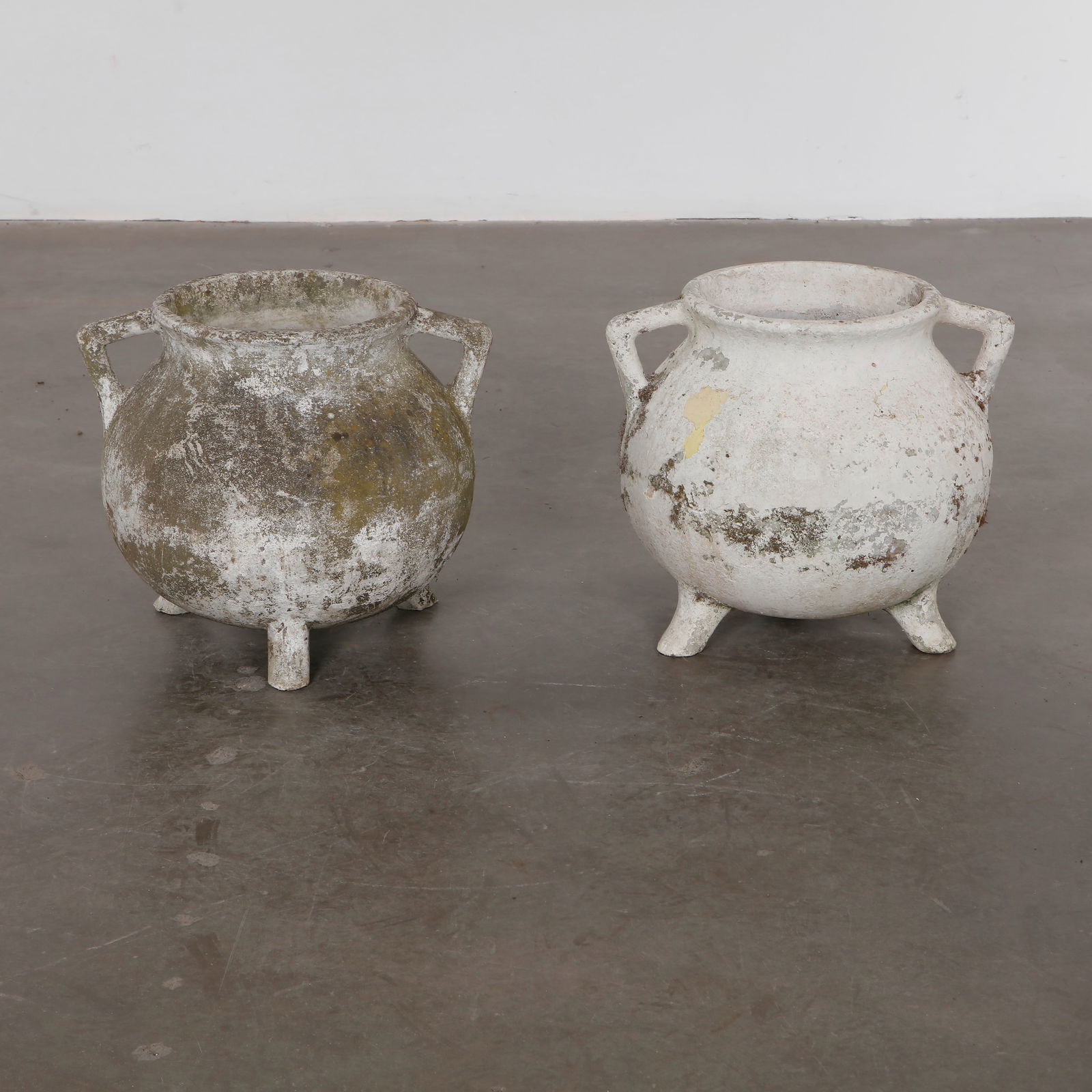 Willy Guhl, Pair of Cauldron Planters, 1960s: Rare cauldron planters by Willy Guhl, with rounded vessel-like shapes and strong sculptural presence. Aged surface adds rustic charm. Opening Diameter: 11.5 in. Overall Diameter: 21 in. Height: 18 in.