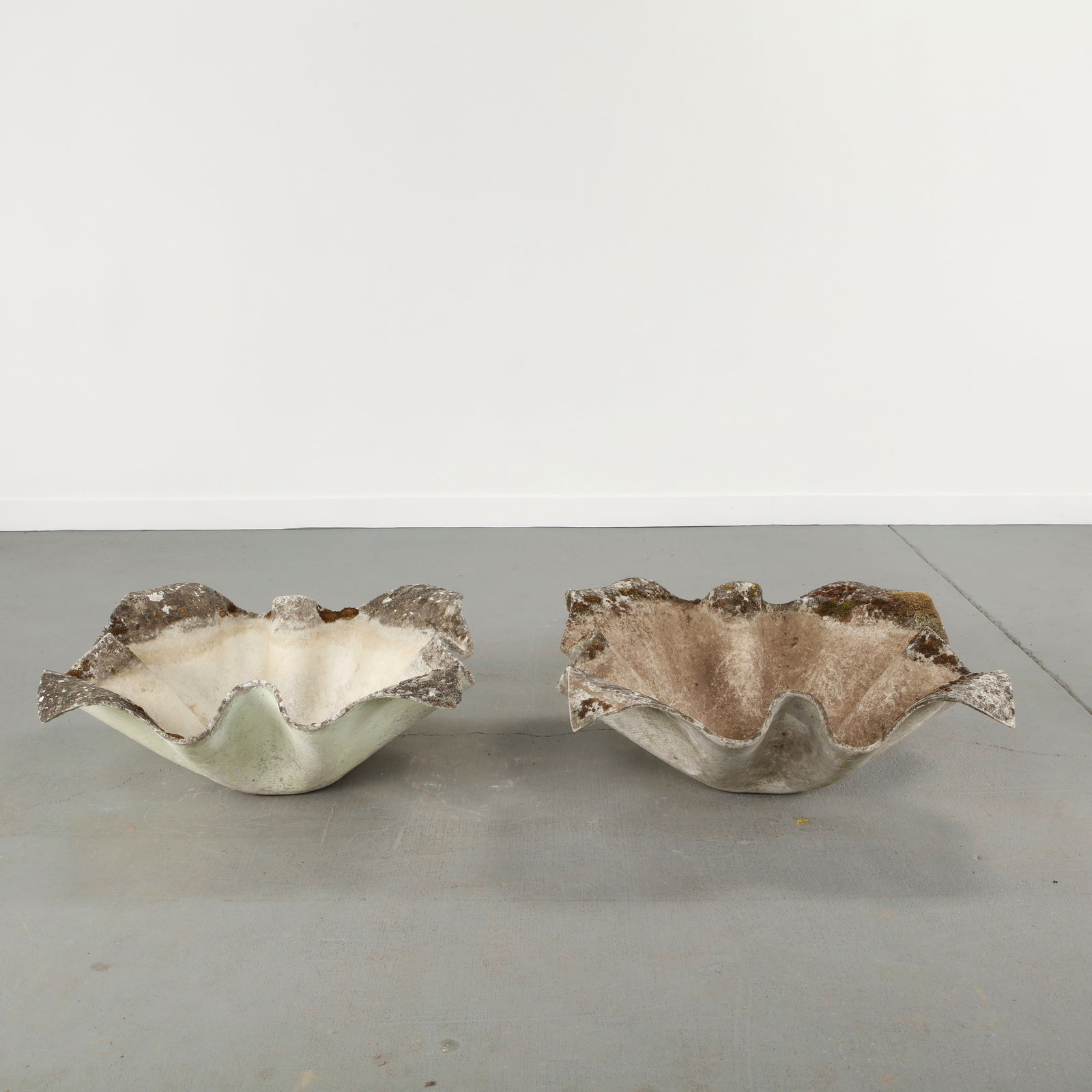 Willy Guhl, Pair of Large Elephant Ear Planters, 1960s: Pair of large Elephant Ear planters, also known as handkerchief planters, by Willy Guhl for Eternit, Switzerland circa 1960. Factory-drilled drainage holes. Wonderful patina. Height: 12.5 in. Length: