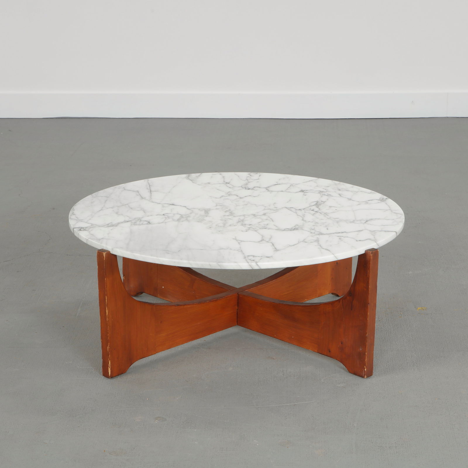 Hugues Poignant, Rosewood and Marble Coffee Table, 1960s: Executed with a wood structure supporting a sculptural marble top, this coffee table exemplifies French mid-century refinement. The dialogue between noble materials and balanced proportions highlights