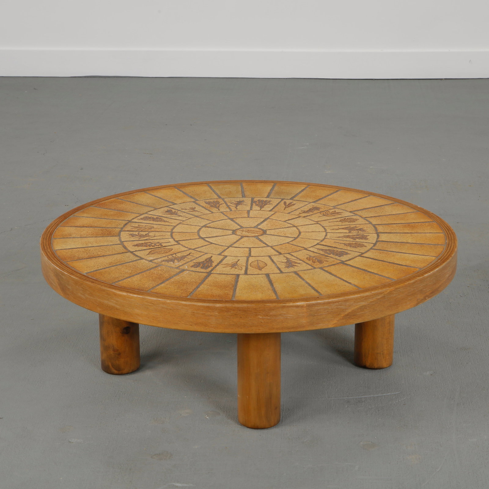 Roger Capron, Garrigue Ceramic Coffee Table, 1960s: Featuring a circular ceramic top decorated with incised vegetal motifs set on a solid pedestal base. A refined example of Capron Garrigue series celebrating Mediterranean nature and craftsmanship. Hei