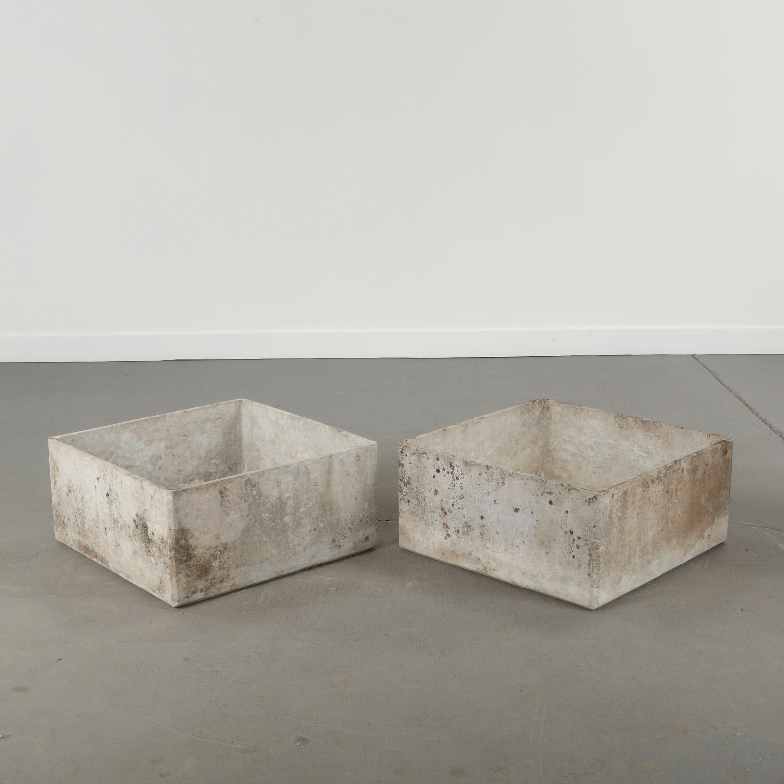 Willy Guhl, Pair of Square Planters, 1960s: Pair of square planters executed in fiber cement, featuring clean architectural lines and a restrained geometric profile characteristic of Willy Guhl's modernist language. The monolithic forms emphasi