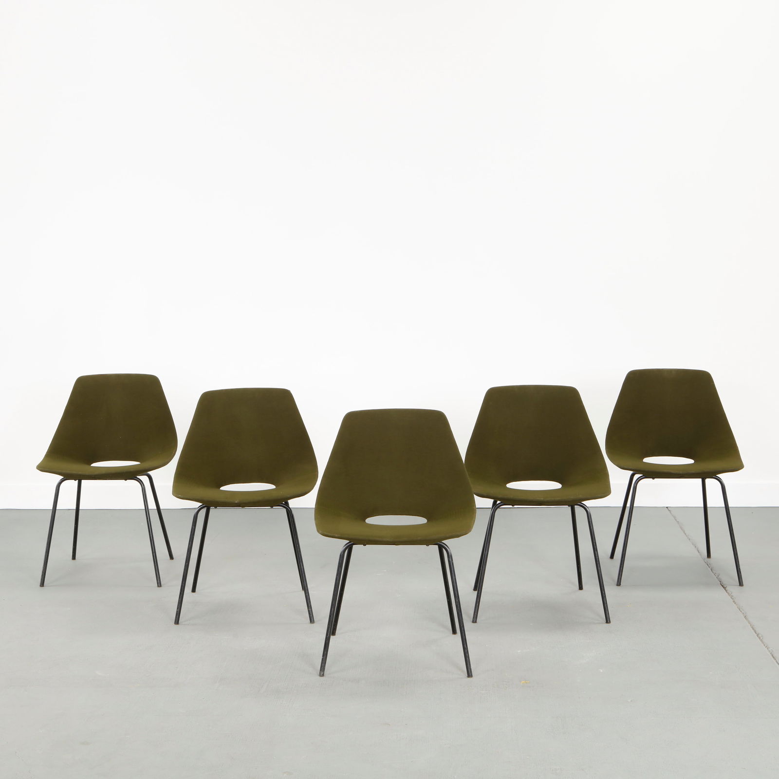 Pierre Guariche, Set of Five Chairs Model Amsterdam, 1960s: Elegant suite of five dining chairs designed by Pierre Guariche, featuring slender blackened metal frames paired with fabric upholstered seats. The Model Amsterdam reflects Guariche mastery of proport
