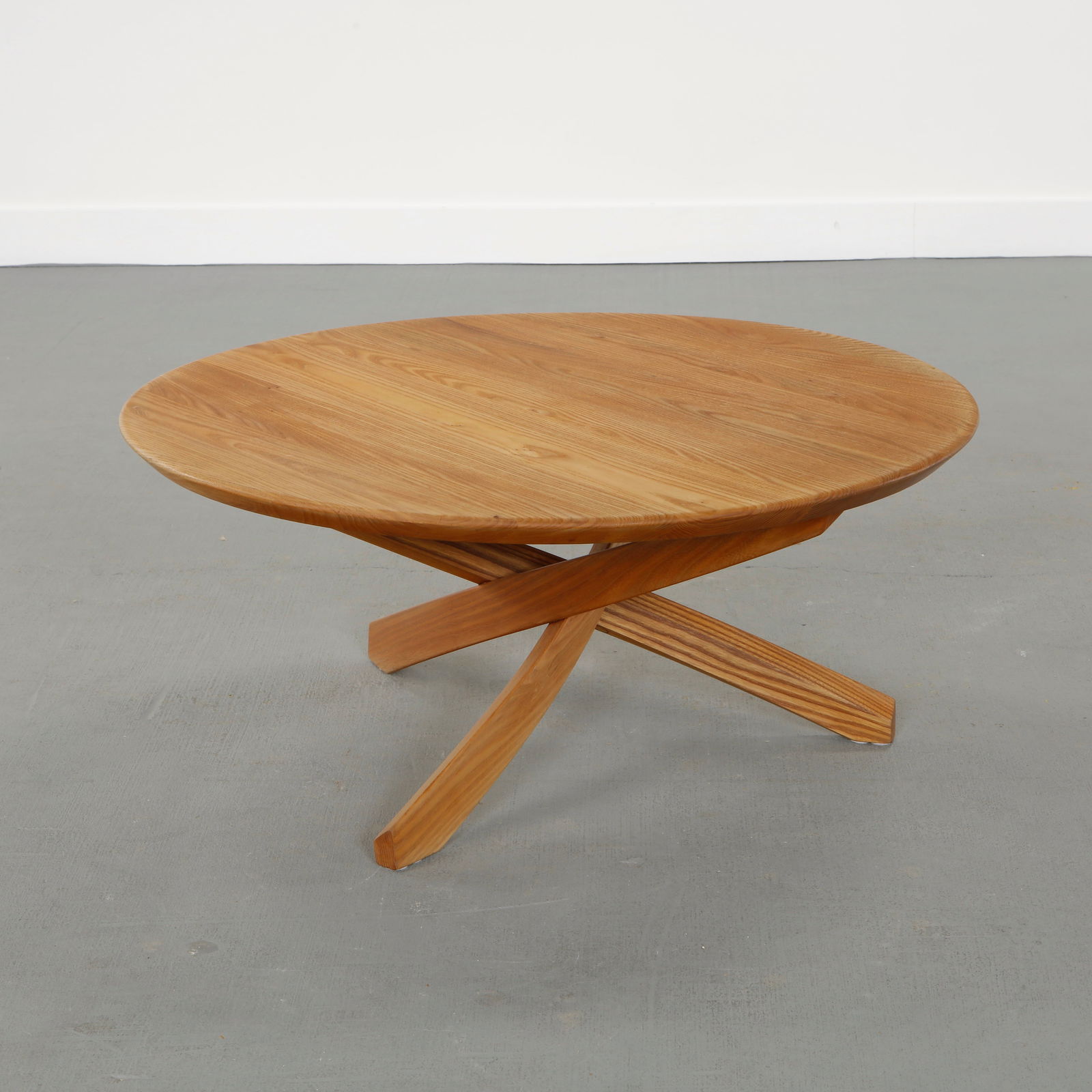 Pierre Chapo for Seltz, Wood Coffee Table, 1980s: Solid wood coffee table with sculptural base and expressive grain, reflecting Pierre Chapo's commitment to honest materials and architectural balance. Height: 16 in. Diameter: 35.5 in.