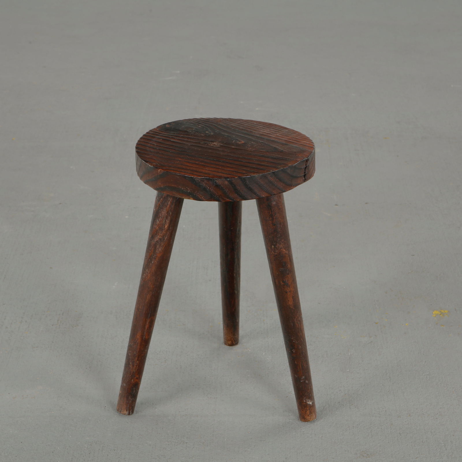 Brutalist Carved Wood Tripod Stool, 1960s: Carved from solid wood with a round seat and pronounced relief decoration, this independent stool displays the same forceful vocabulary of hand-sculpted brutalist furniture while standing as a singula