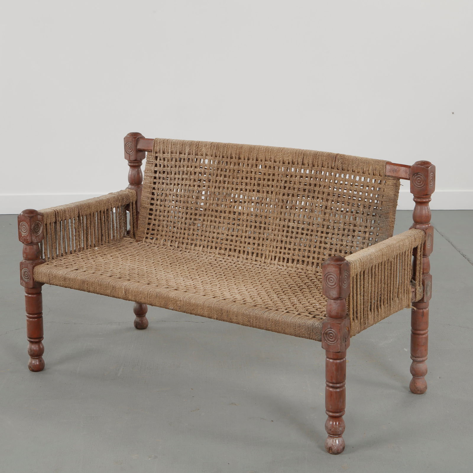 Audoux-Minet, Wood and Rope Bench, 1950s: Crafted in solid wood and handwoven rope, combining sculptural presence with tactile materials rooted in Mediterranean craft traditions emblematic of French midcentury design. Height: 29.5 in. Width: