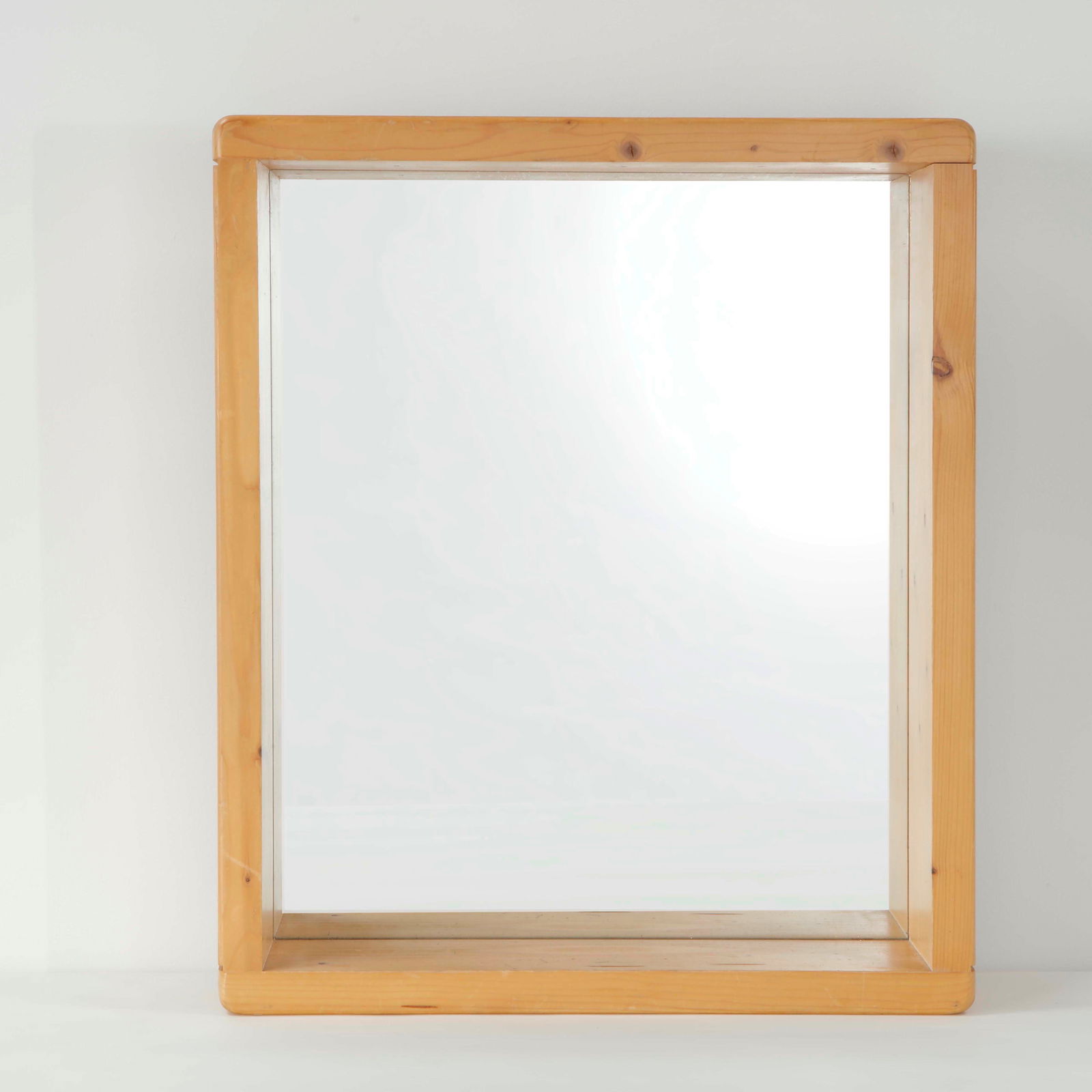 Maison Regain, Pine Mirror, 1960s: Single mirror executed in solid pine with clean proportions and expressive grain. A refined decorative element rooted in French modern rustic design. Height: 24 in. Length: 20 in. Depth: 4.5 in.