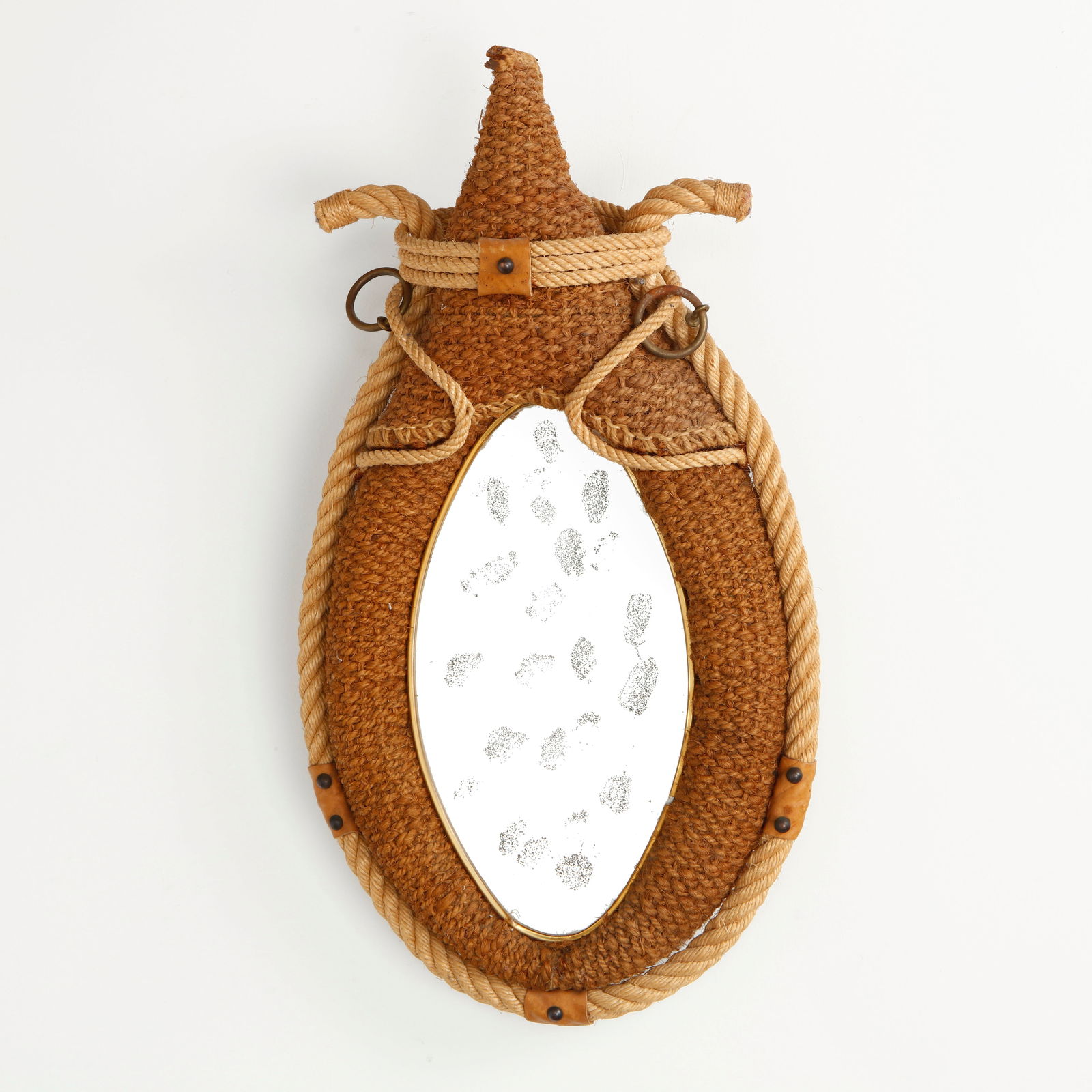 Audoux Minet, Rope Mirror, 1950s: Executed in tightly woven rope with sculptural braided detailing and leather accents, this mirror exemplifies the rustic elegance characteristic of Audoux Minet. The oval glass is set within a richly