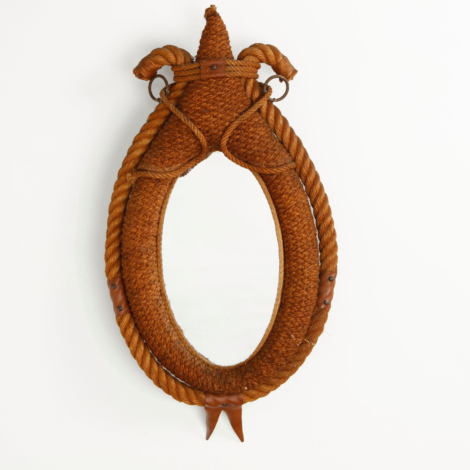 Audoux Minet, Large Rope Mirror, 1950s: Executed in tightly woven rope with sculptural braided detailing and leather accents, this mirror exemplifies the rustic elegance characteristic of Audoux Minet. The oval glass is set within a richly