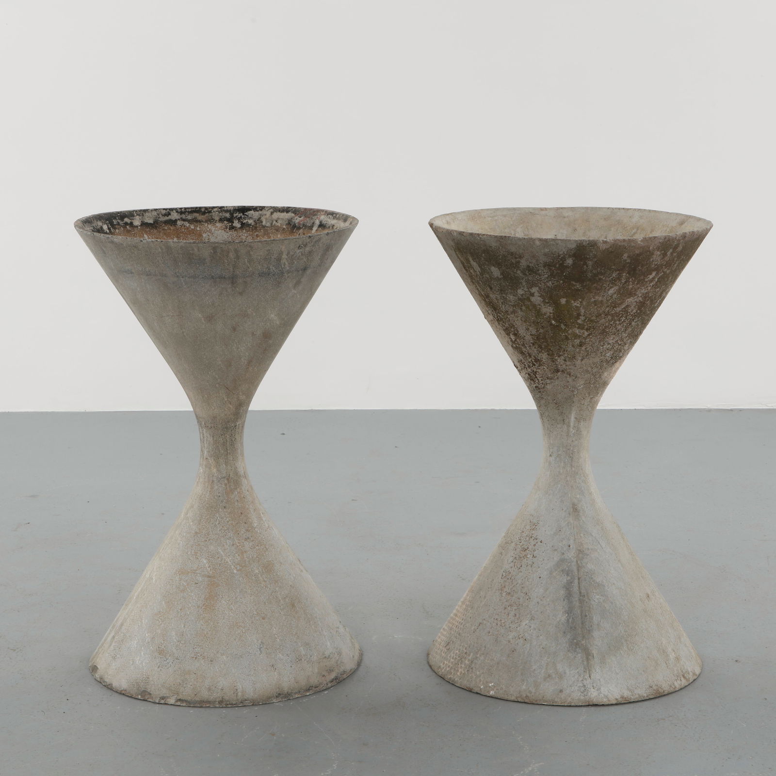Willy Guhl, Pair of Large Diabolo Planters, 1960s: Pair of Willy Guhl large diabolo planters manufactured by Eternit, Switzerland. Height: 36 in. Width: 22 in.