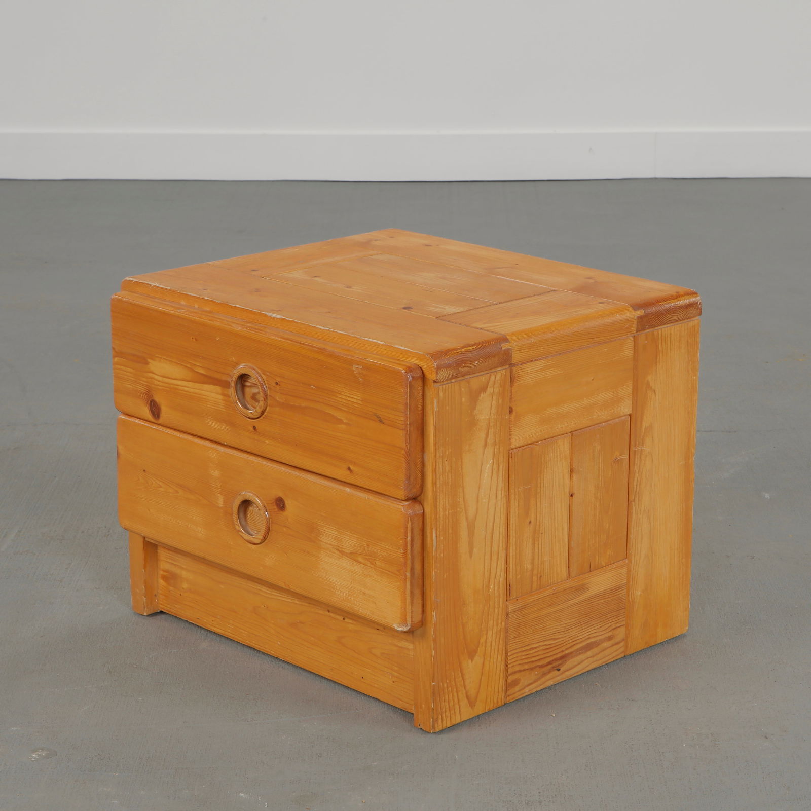 Charlotte Perriand for Les Arcs 1600, Pine Nightstand, 1960s: Solid pine nightstand table designed by Charlotte Perriand for Les Arcs resort, featuring minimalist lines and integrated drawers pull. France, 1960s. Height: 16 in. Length: 20 in. Width: 18 in.