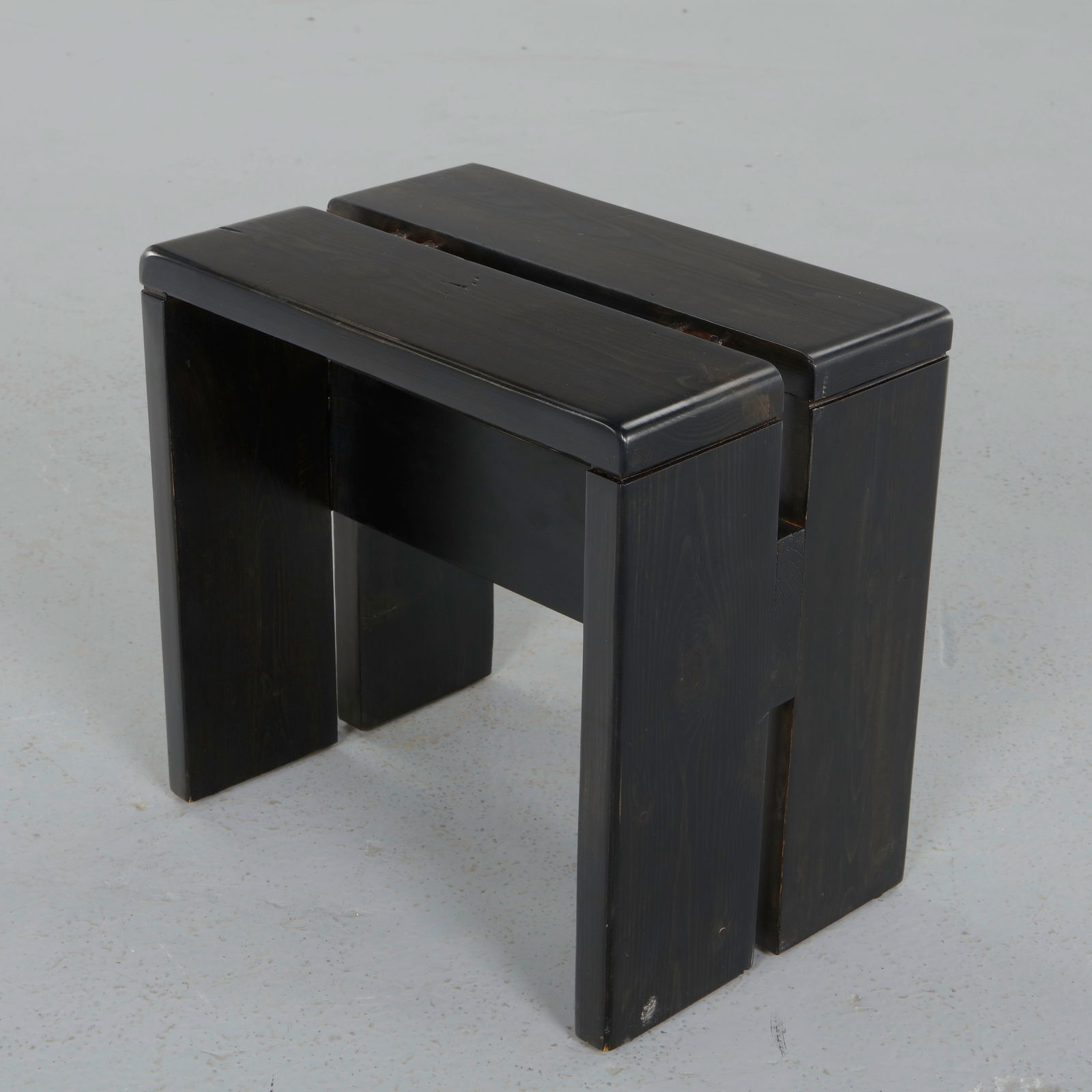 Charlotte Perriand for Les Arcs 1600, Black Pine Stools, 1960s: Crafted in stained pine, this stool reflects the rigorous alpine vocabulary developed for Les Arcs. The architecture and compact proportions of the building embody Perriand functional approach, where