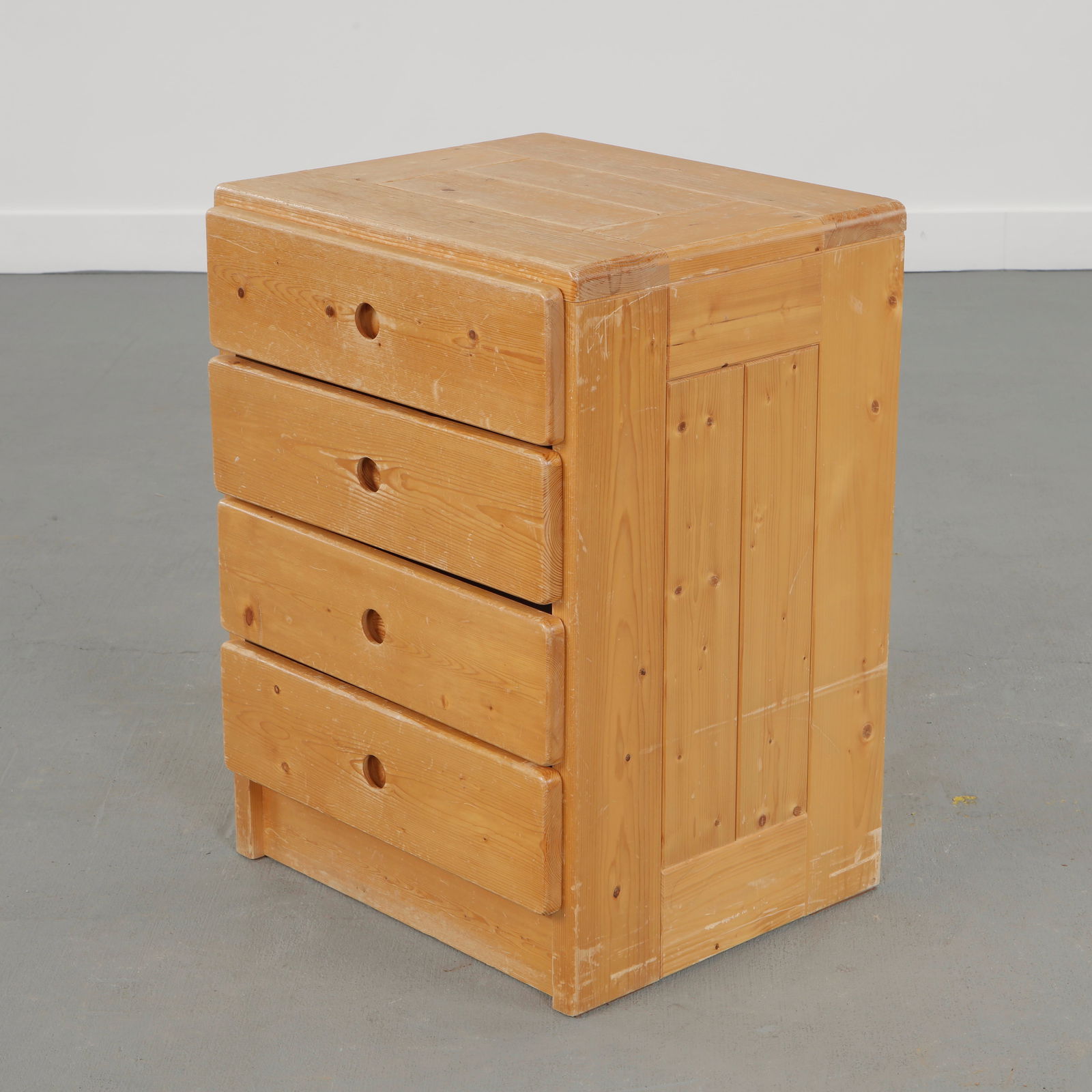 Charlotte Perriand for Les Arcs 1600, Pine Chest of Drawers, 1960s: Compact chest in solid pine with four drawers, each featuring Perriand signature recessed circular handles. A utilitarian design elevated by impeccable proportions. Height: 27.5 in. Width: 20 in. Dept
