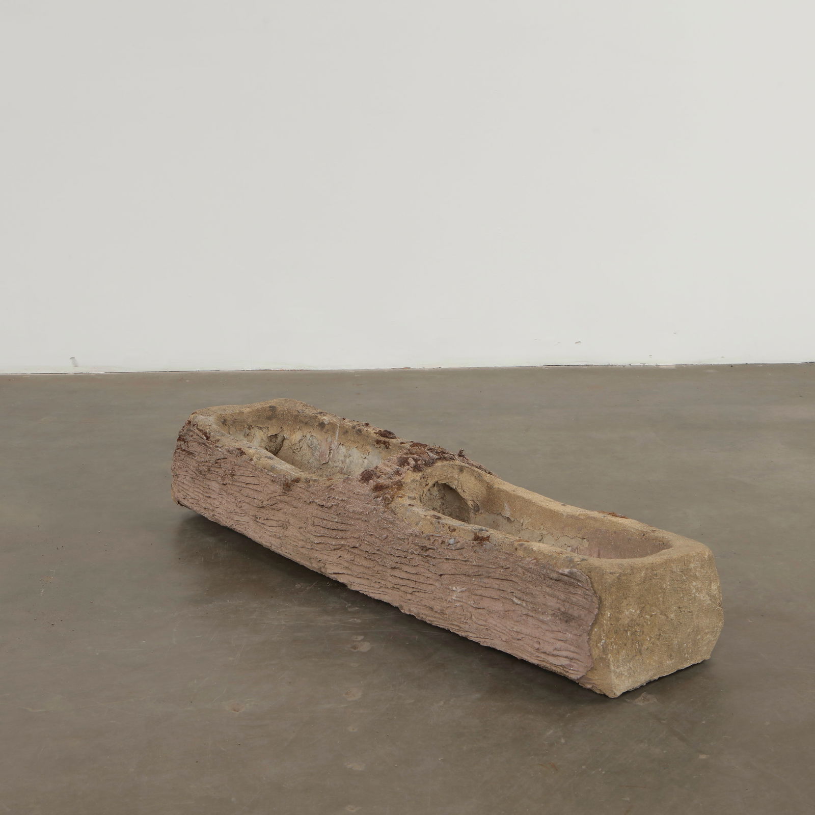 Monumental Faux Bois Planter, 1960s: Large-scale faux-Bois planter rendered with deeply carved bark textures and an organic, irregular form. Its impressive scale makes it a statement piece within any garden composition. Height: 15 in. Wi