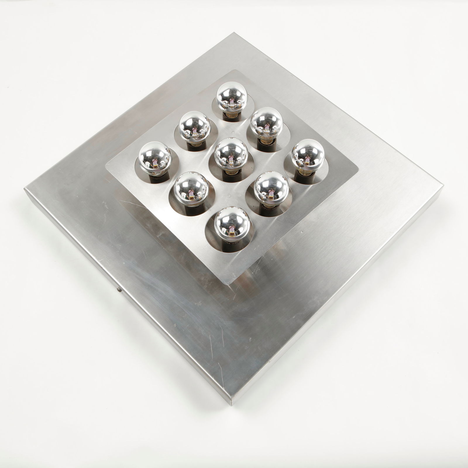 Vintage Space Age Chrome-Plated Ceiling Lamp attributed to Motoko Ishii for Staff, 1970s: Featuring a geometric chrome-plated structure fitted with multiple spherical bulbs, this ceiling lamp embodies the futuristic aesthetic of the Space Age era. The reflective surfaces and modular