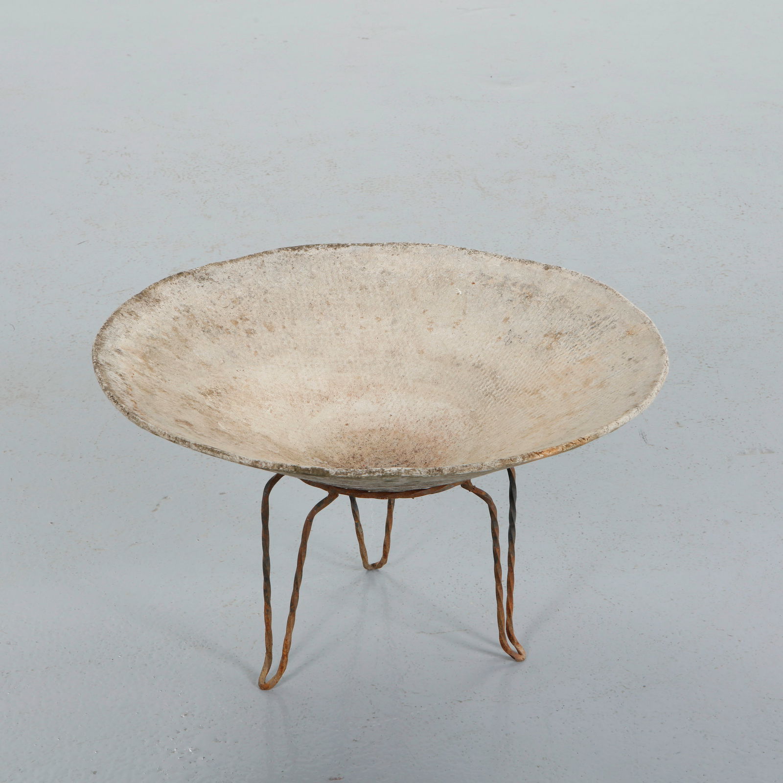 Willy Guhl, Conical Planter on Stand, 1960s: Executed in fiber cement with a wide conical basin resting on slender iron supports, this planter exemplifies Willy Guhl mastery of sculptural outdoor form. The textured surface and soft weathered pat