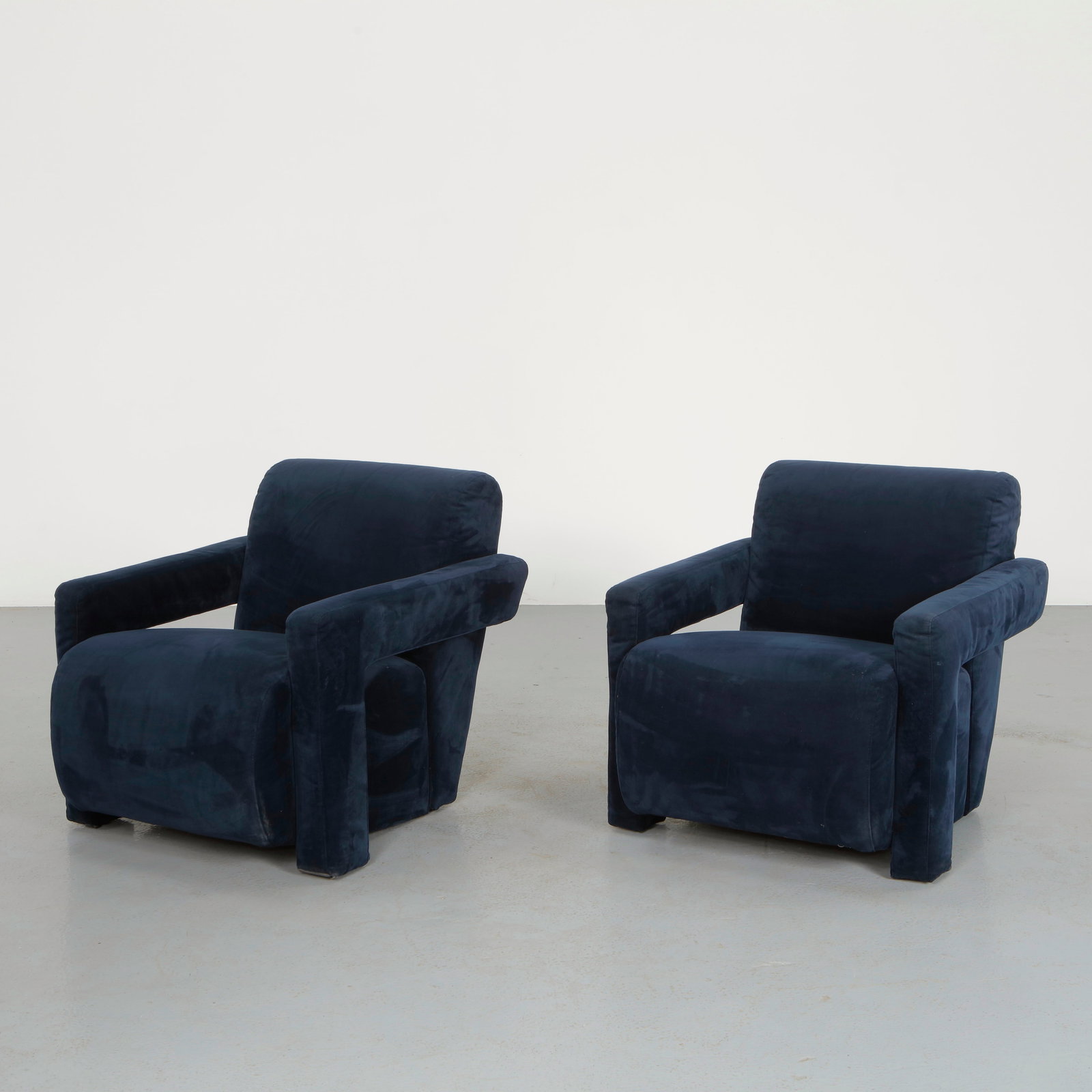 Gerrit Thomas Rietveld, Pair of 637 Utrecht Velvet Armchairs, 1990: Pair of architectural armchairs featuring geometric volumes with pronounced armrests and angled backrests. Upholstered in deep velvet accentuating the strong structural lines of the design. A modern