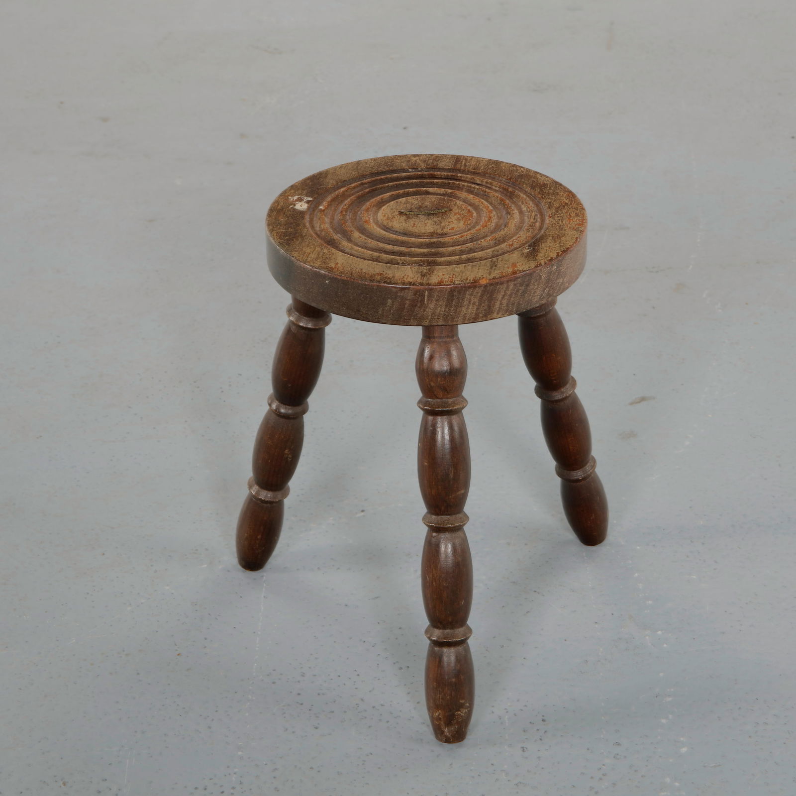 Tripod Stool attributed to Charles Dudouyt, 1950s: Tripod stool attributed to Charles Dudouyt crafted in solid wood featuring turned legs and a thick circular seat. The restrained proportions and visible craftsmanship evoke the rustic modern language