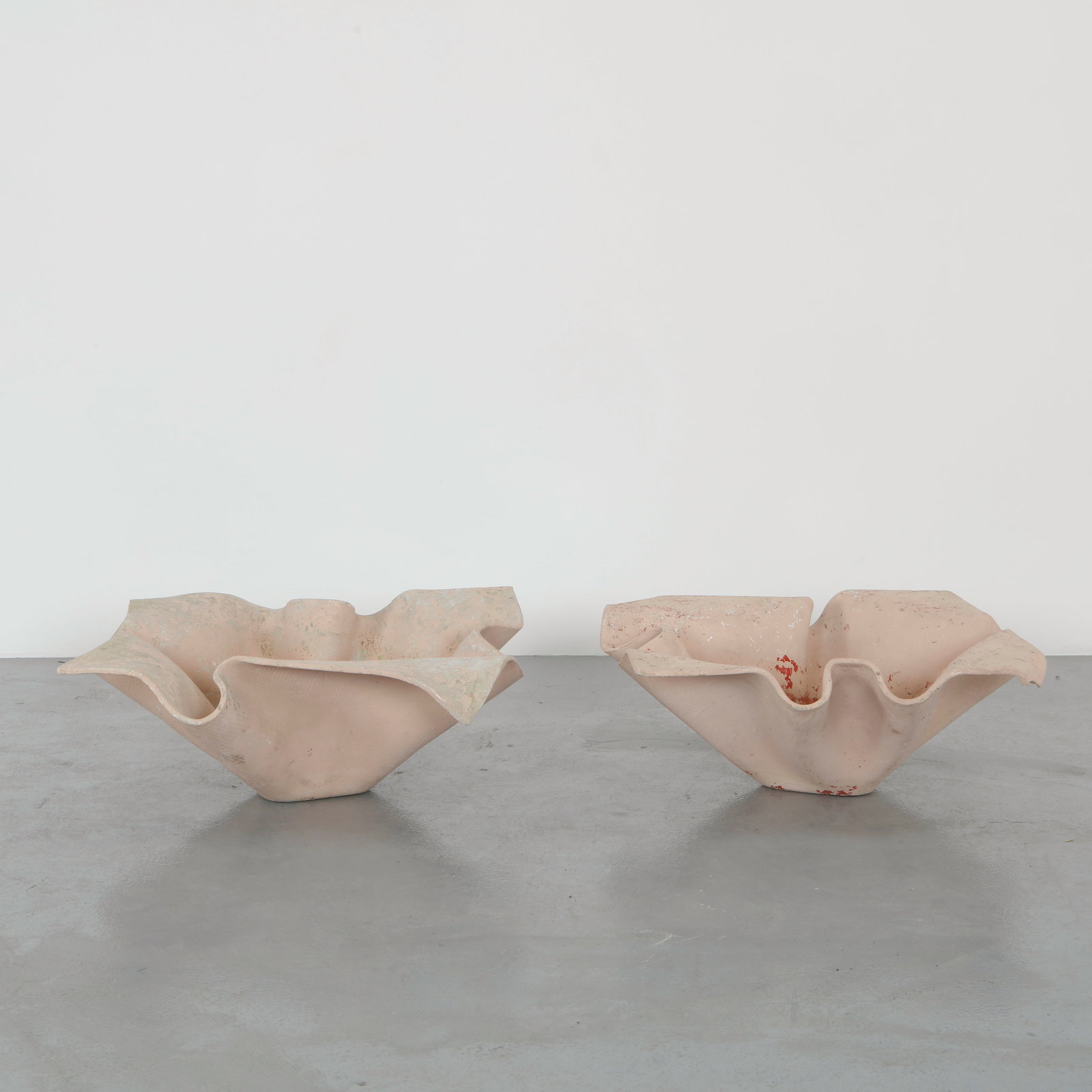Willy Guhl, Pair of Large Elephant Ear Planters, 1960s: Pair of Large Elephant Ear planters, also known as handkerchief planters, by Willy Guhl for Eternit, Switzerland circa 1960. Factory-drilled drainage holes. Wonderful patina. Width: 35 in. Length: 35