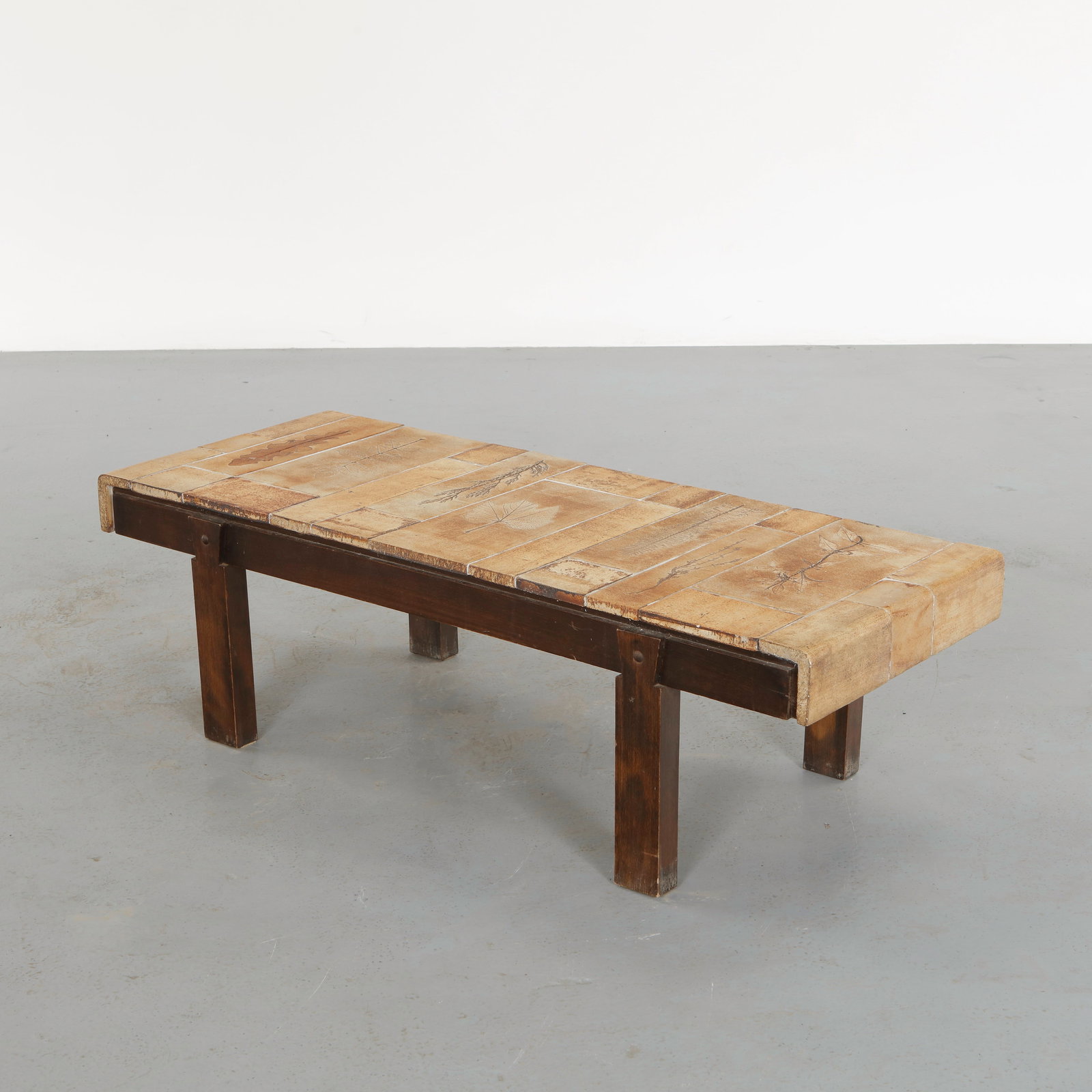 Roger Capron, Garrigue Ceramic Coffee Table, 1960s: Composed of hand decorated ceramic tiles featuring delicate botanical impressions, the surface illustrates Capron exploration of natural motifs. The slender metal frame provides a light architectural