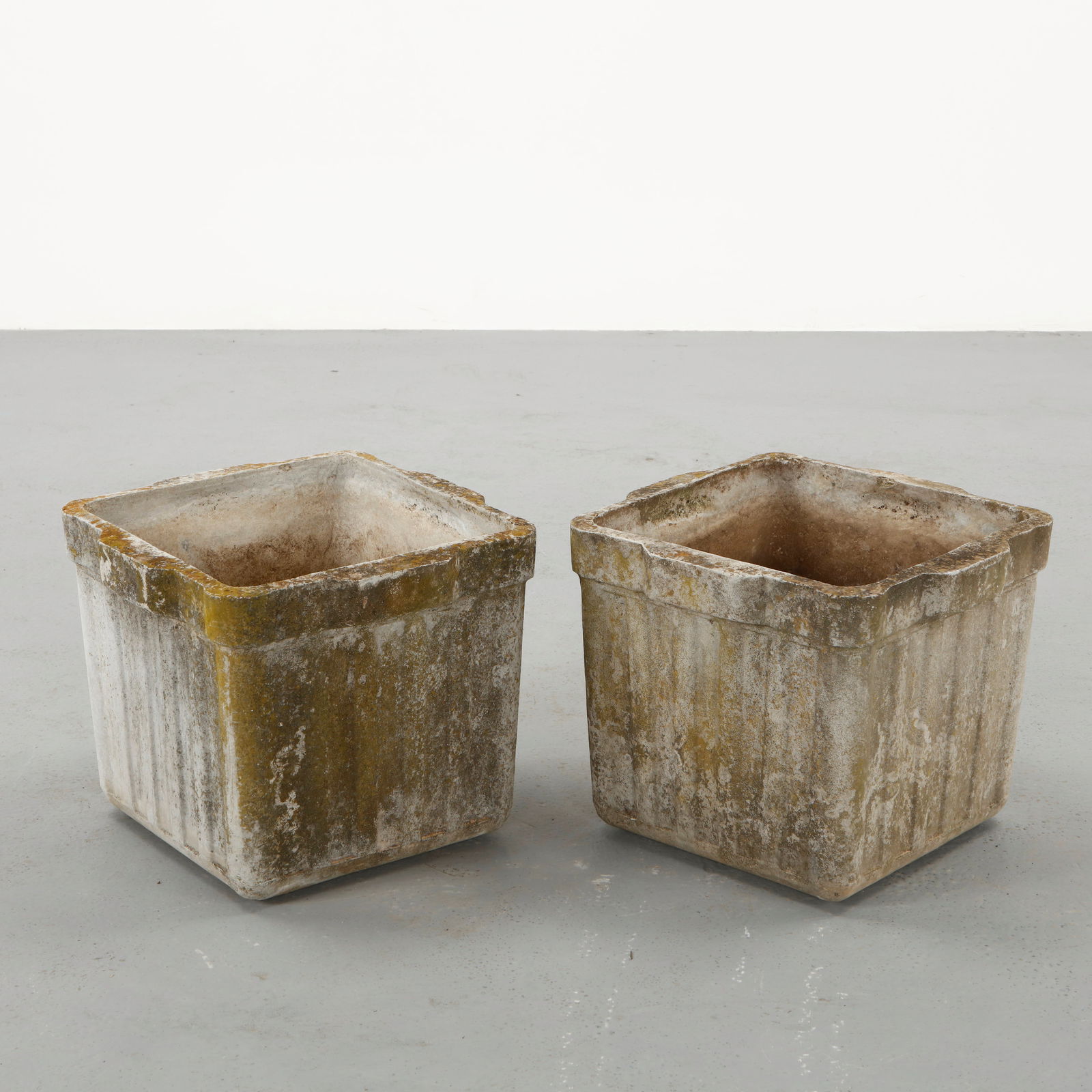 Willy Guhl, Pair of Square Planters, 1960s: Pair of square planters designed by Willy Guhl and produced by Eternit in molded fiber cement. The restrained geometry emphasizes the architectural clarity of the form while the naturally aged surface