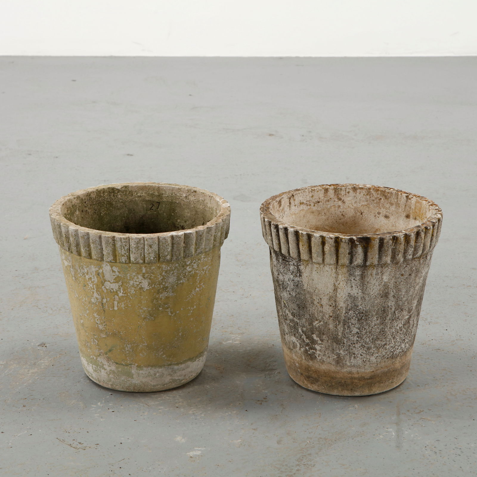 Willy Guhl, Pair of Round Planters, 1960s: Pair of cylindrical planters designed by Willy Guhl and produced by Eternit in fiber cement. The simple rounded form reflects the designer focus on essential geometry and material honesty. Their