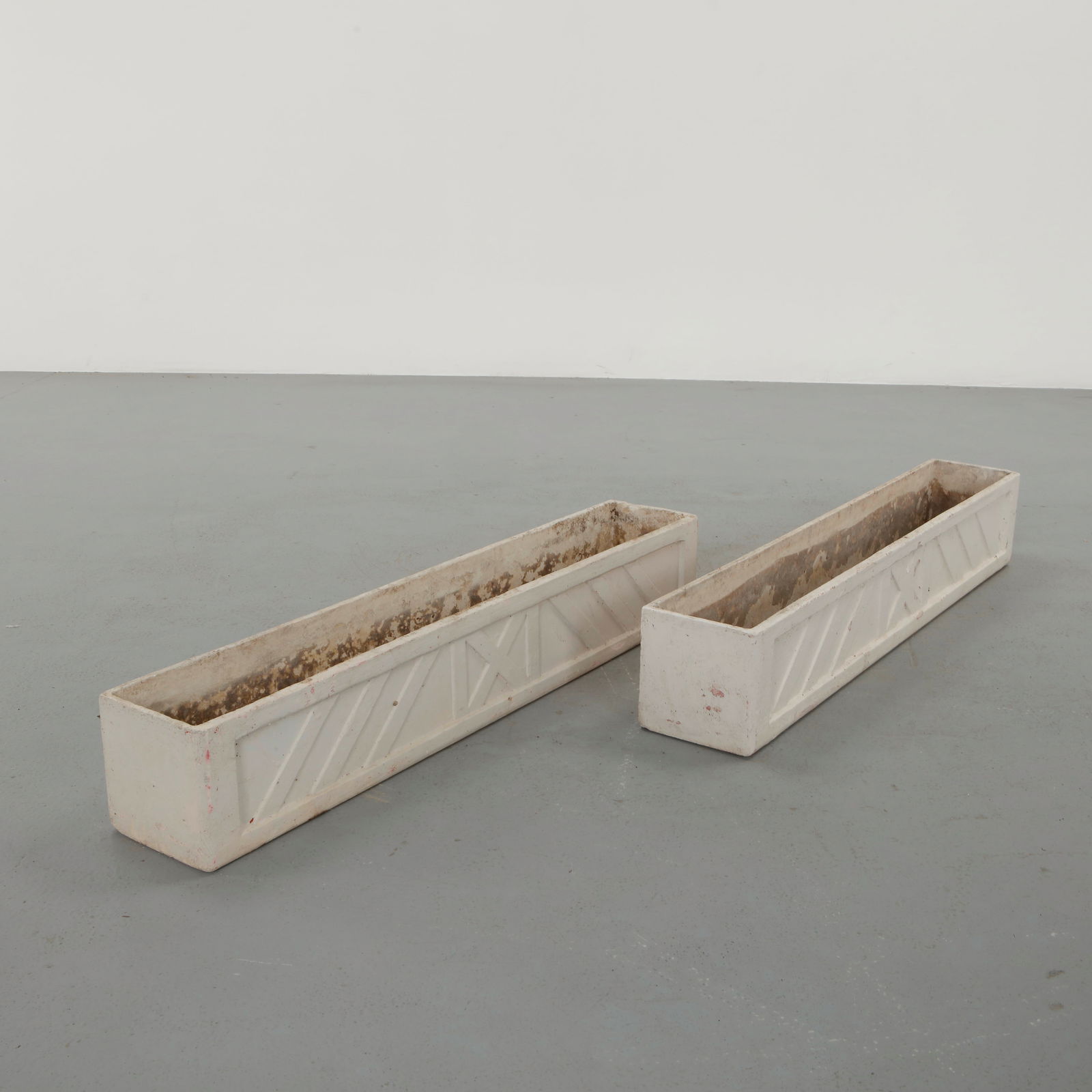 Willy Guhl, Pair of Long Rectangular Planters, 1960s: Classic rectangular Eternit planter designed by Willy Guhl. Timeless Swiss design with natural patina from outdoor use. Height: 8 in. Width: 47.25 in. Depth: 8 in.
