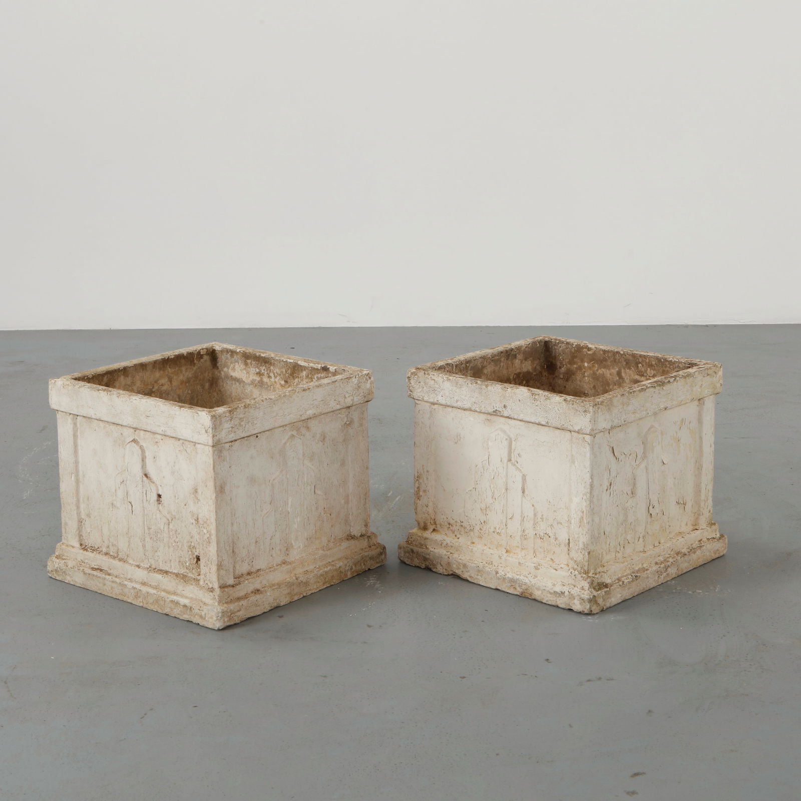 Pair of Concrete Square Planters, 1960s: Pair of square concrete planters featuring clean architectural lines and softly weathered surfaces. The restrained geometry highlights the material presence and utilitarian garden function.
