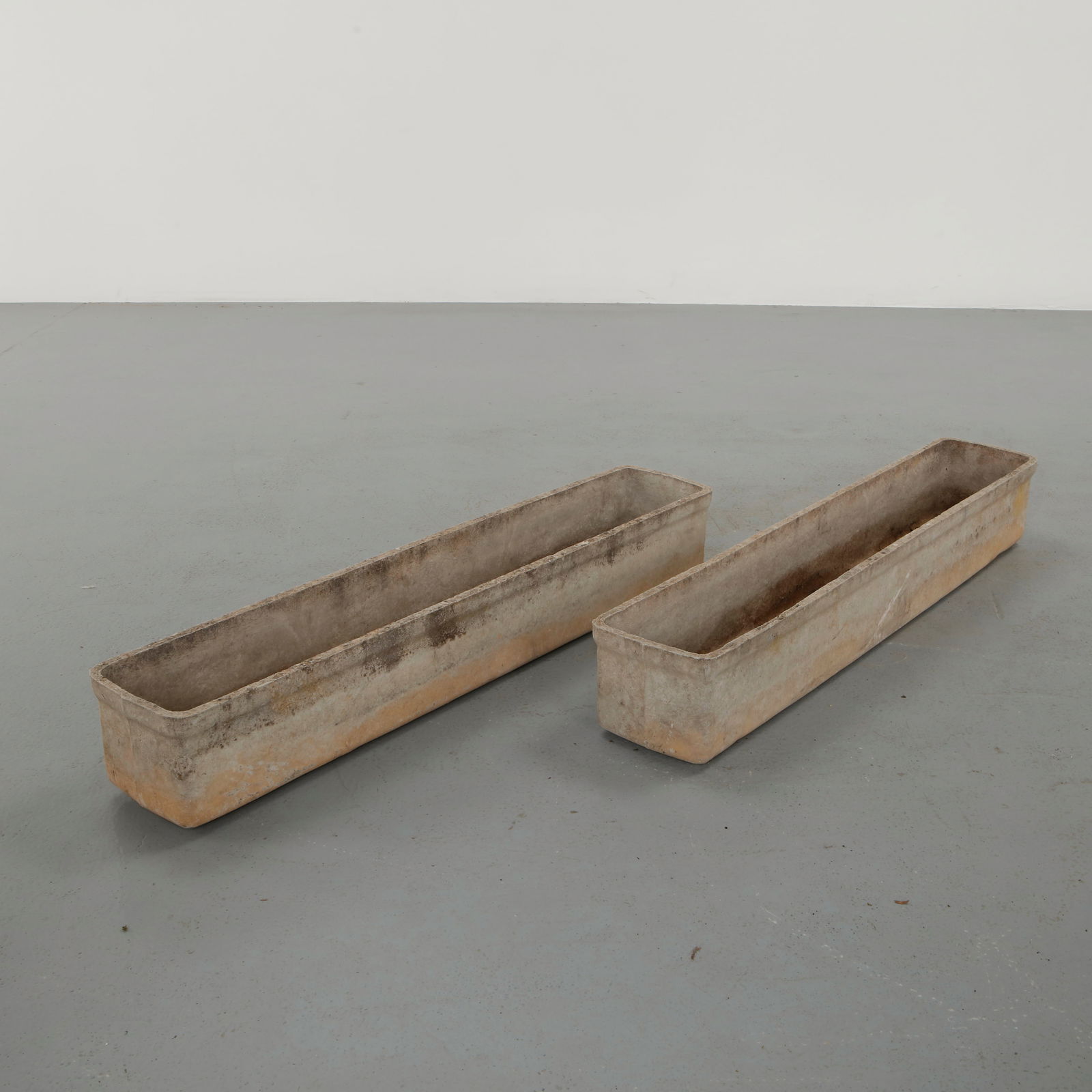 Willy Guhl, Pair of Long Rectangular Planters, 1960s: Classic rectangular Eternit planter designed by Willy Guhl. Timeless Swiss design with natural patina from outdoor use. Height: 7.5 in. Width: 47 in. Depth: 8.25 in.