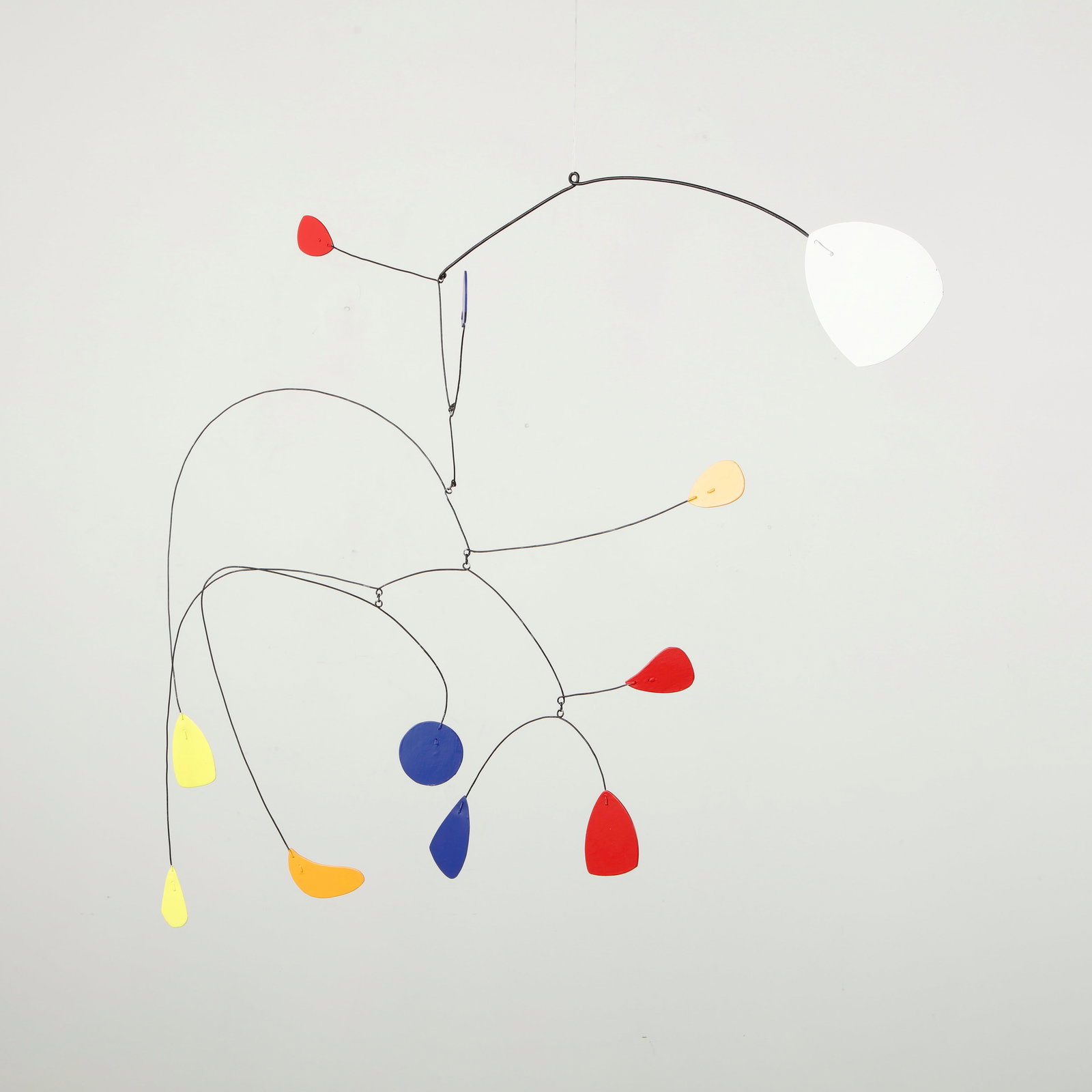 Abstract Hanging Metal Sculpture, 1980s: Delicate suspended mobile executed in bent metal wire supporting a constellation of painted metal elements in vivid primary tones. The composition unfolds in rhythmic balance, each form gently moving