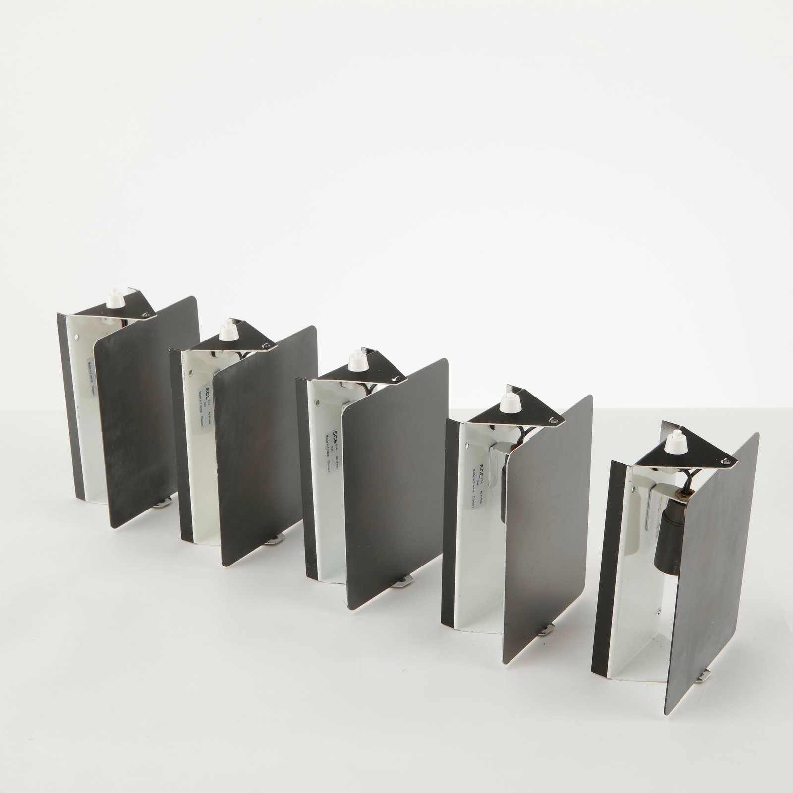 Charlotte Perriand, Set of Five CP1 Wall Sconces, 1963: Set of Five Charlotte PerriandÂ CP1 Wall Sconces Black and white pivoting aluminum wall lights, an iconic modernist design by Perriand. Height: 5.9 in. Length: 6.45 in. Width: 2.5 in.
