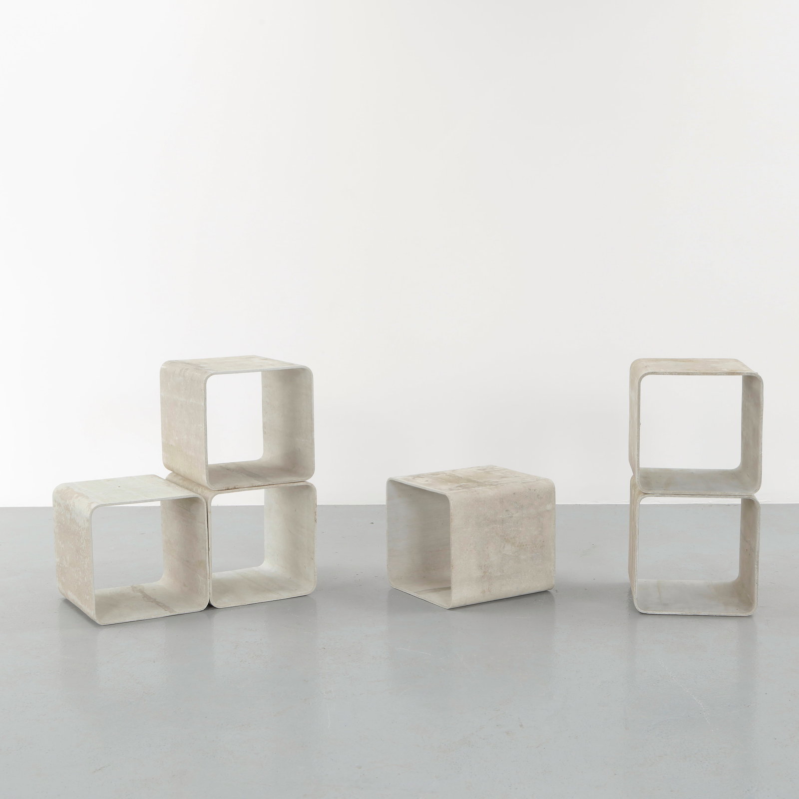 Willy Guhl, Set of Six Modular Cement Cube Library, 1960s: Cast in fiber cement with a distinctive curved profile, these modular units demonstrate Guhl innovative use of industrial materials. Their sculptural form allows versatile stacking or alignment. A rar