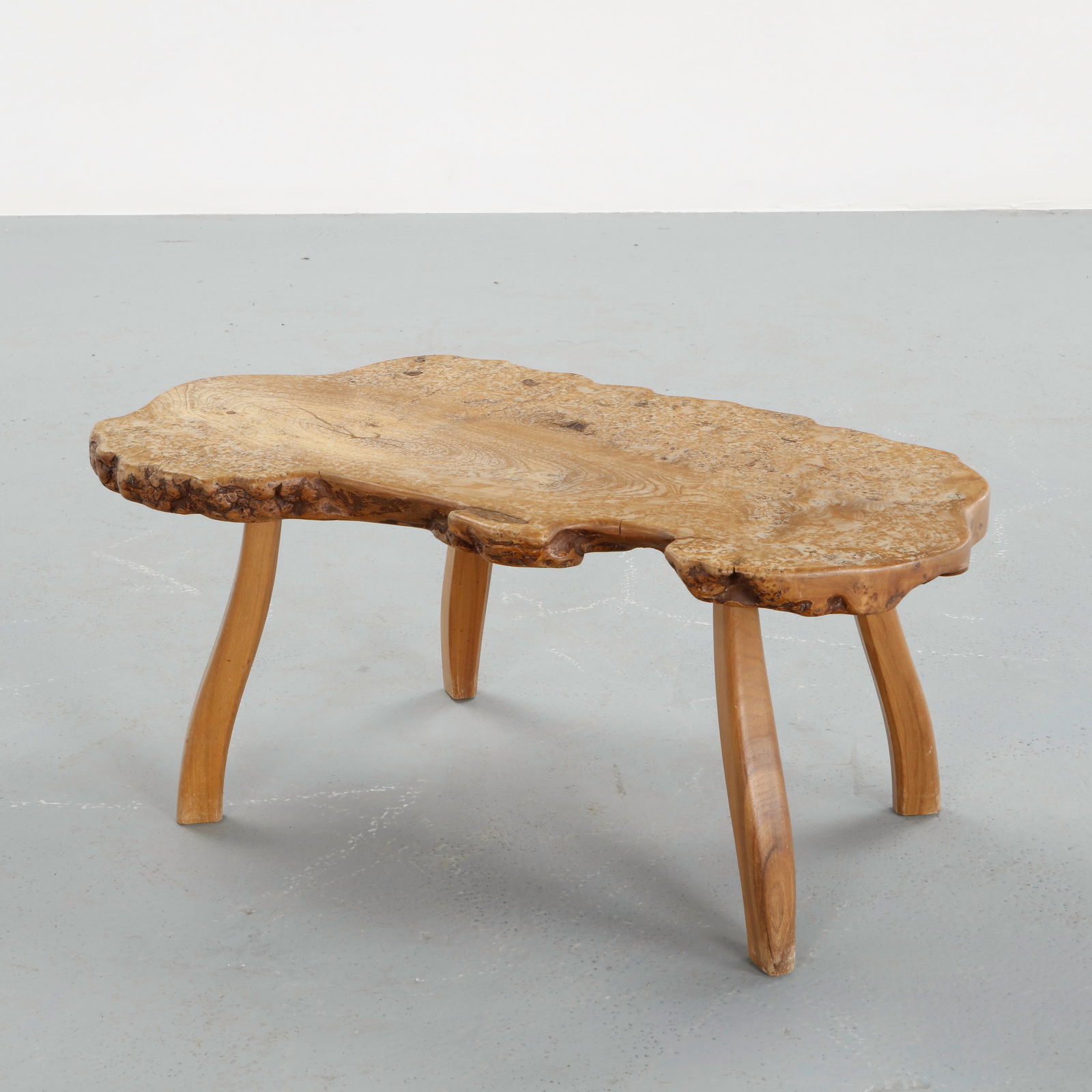 Root Wood Coffee Table in the style of George Nakashima, 1960s: Carved from a single tree root and executed as a freeform sculptural table. The organic top preserves the natural contours and grain, resting on an integrated root base. A powerful example of mid-cent