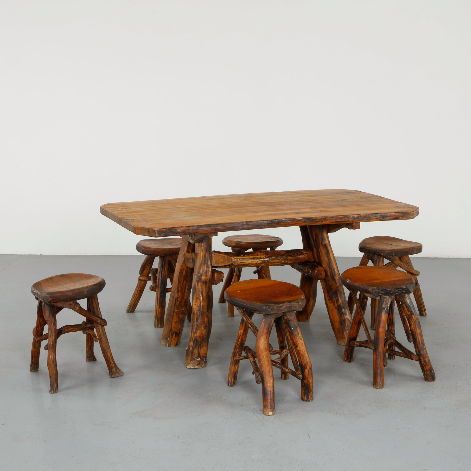 Brutalist Wood Dining Set, 1960s: Executed in solid wood with branch like construction, this dining set embodies a sculptural and expressive brutalist aesthetic. The organic joinery and textured surfaces highlight handcrafted techniqu