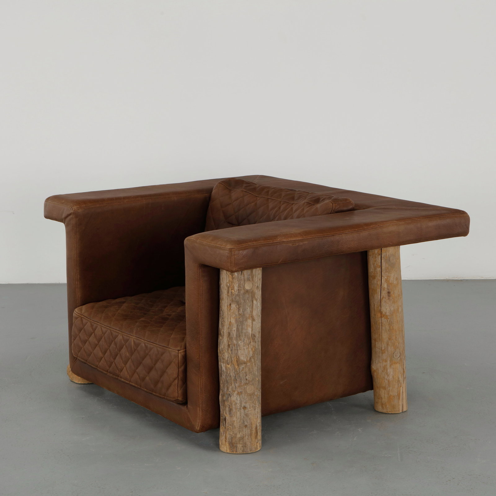 Mattak by Bleu Nature, Leather Club Lounge Chair: Lounge chair upholstered in leather with generous proportions and enveloping form. The aged patina enhances its character, reflecting mid century comfort driven design. Height: 28 in. Width: 48 in. De