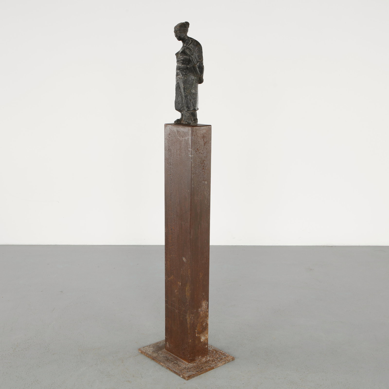 M. Clerc, Bronze Figure on Metal Pedestal, Numbered 1 of 8, 1950s: Expressive bronze figure rendered with a restrained, contemplative posture, mounted on a tall patinated metal pedestal. This limited edition example reflects a refined sculptural language, balancing v