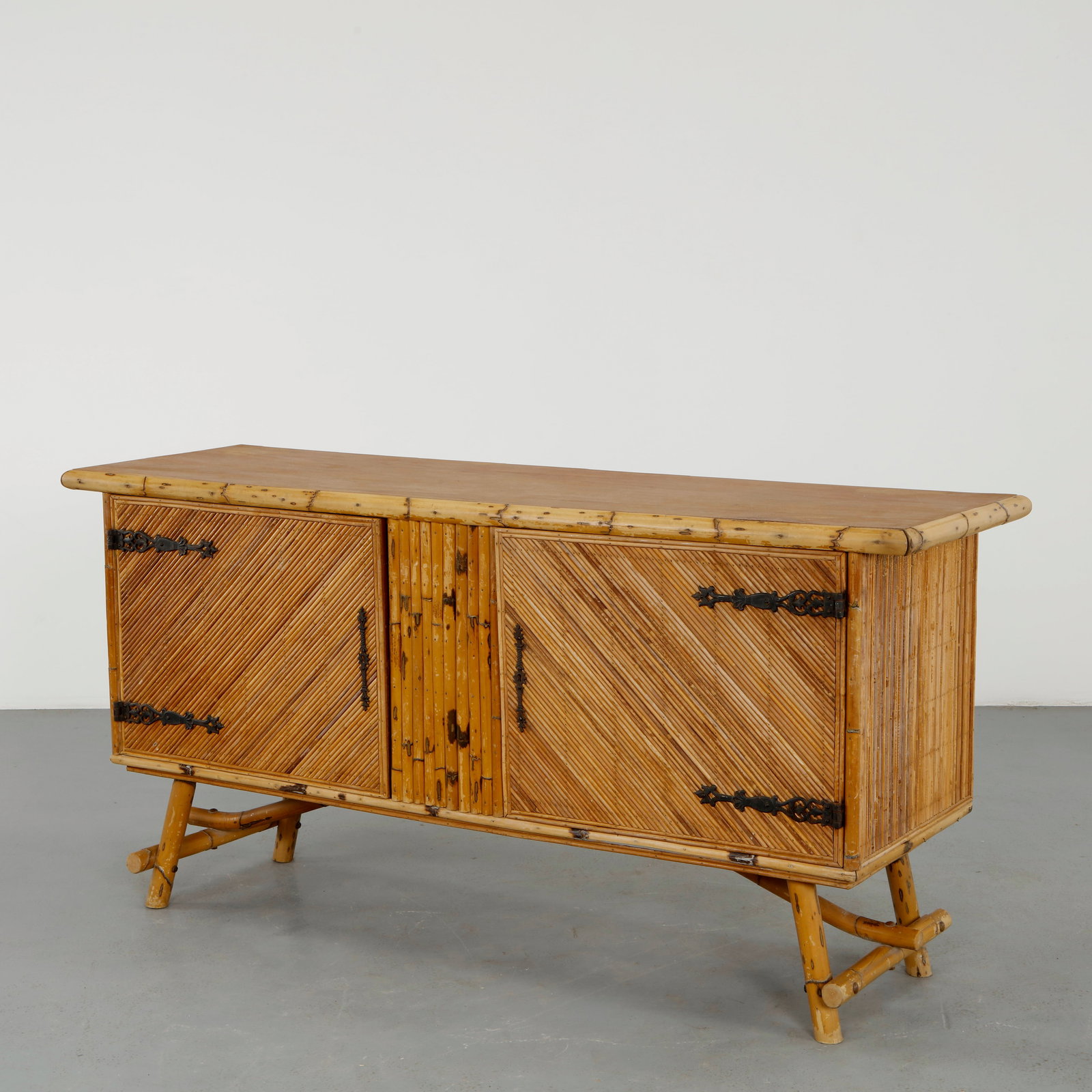 Adrien Audoux and Frida Minet, Bamboo Sideboard, 1960s: Executed in bamboo with woven panel doors, this sideboard exemplifies Audoux Minet organic aesthetic. The use of natural materials and handcrafted detailing creates a sculptural and tactile presence.