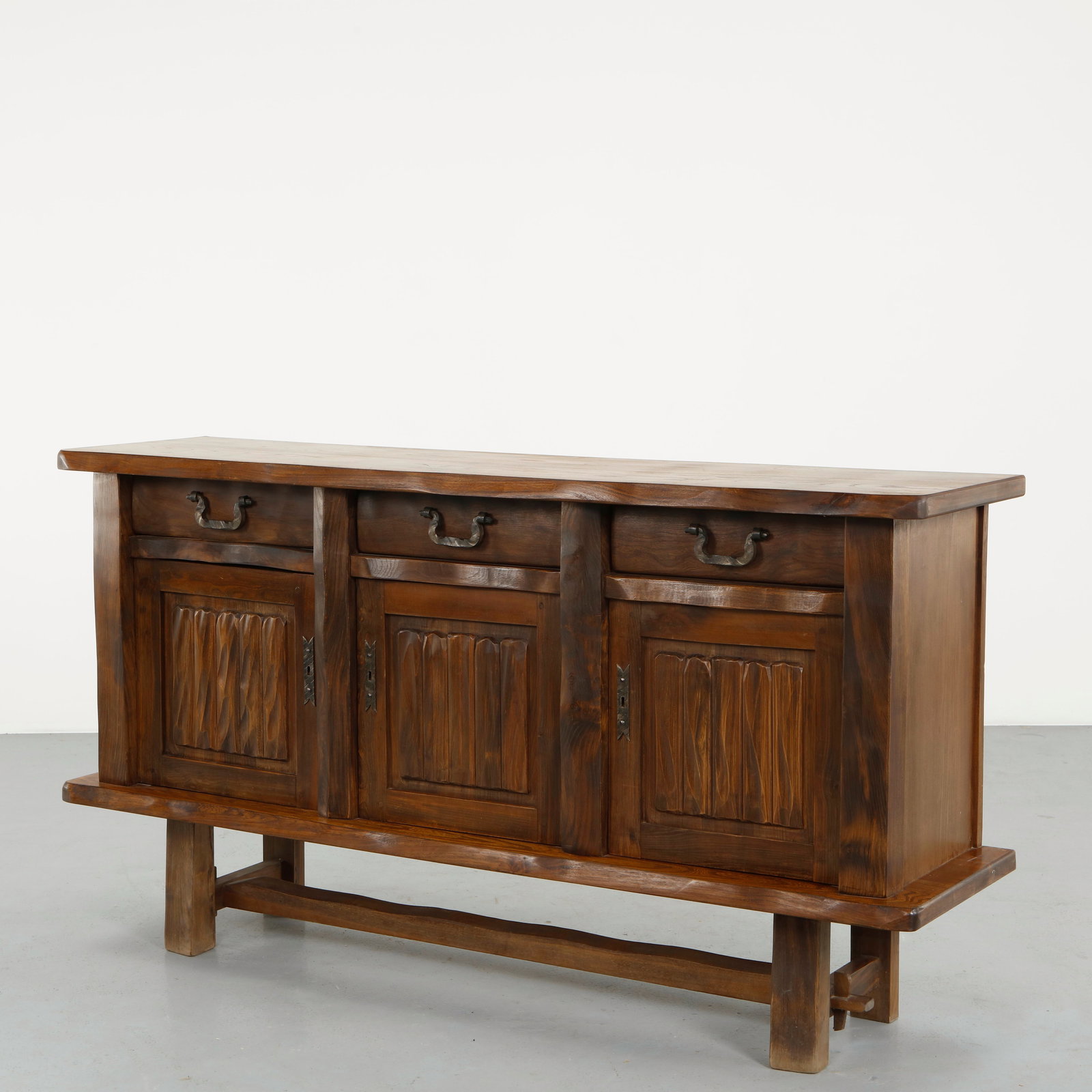 Olavi Hanninen For Mikko Nupponen, Brutalist Sculptural Sideboard, 1950s: Crafted in solid wood, this sideboard features deeply carved panels and bold geometric construction. The expressive surface treatment reflects Hanninen approach to material and form. A rare and