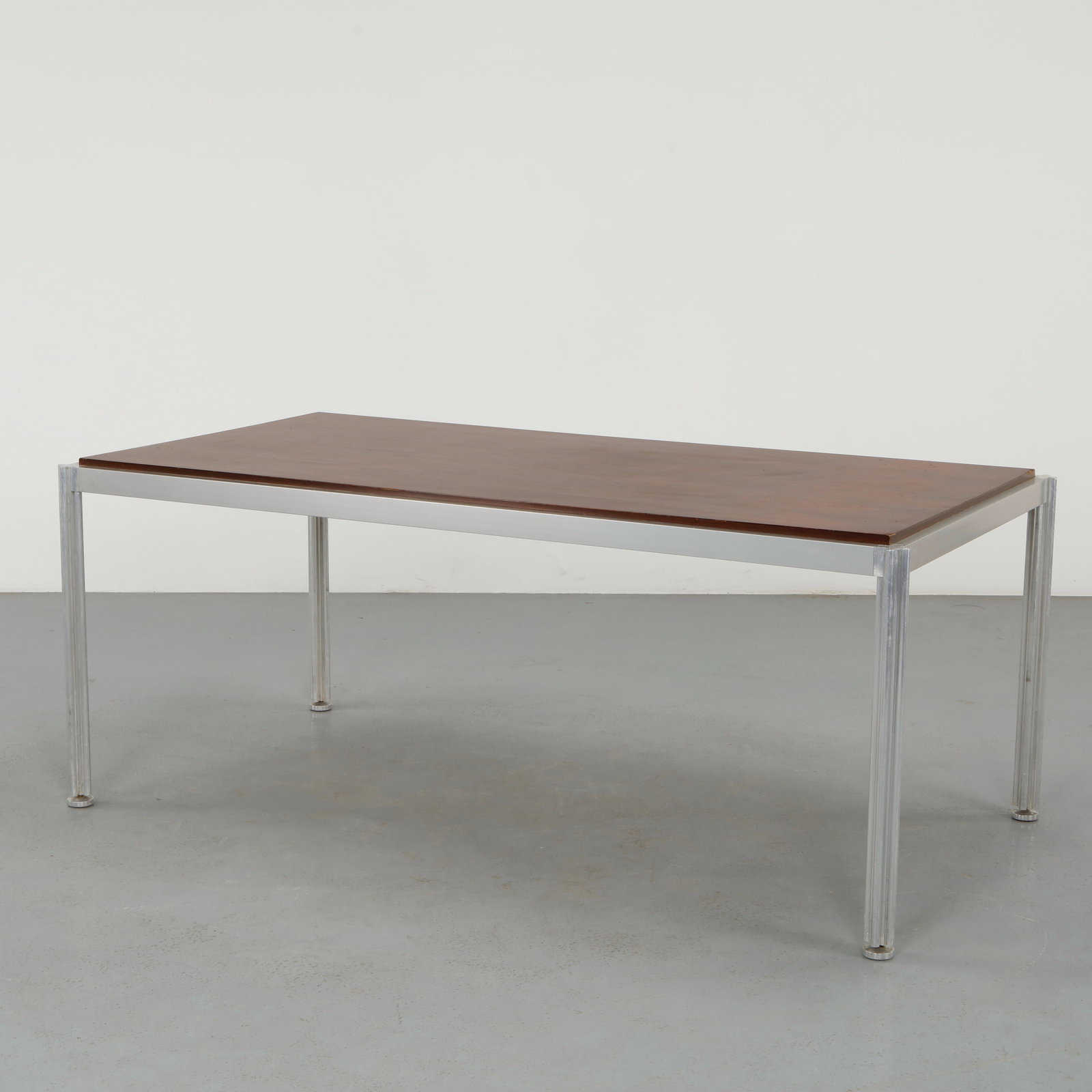 George Ciancimino, Shamrock Dining Table, 1960s: Dining table featuring a wooden top framed with a metal edge, supported by a sculptural base. The legs terminate in distinctive clover shaped forms, giving the piece its Shamrock identity while mainta