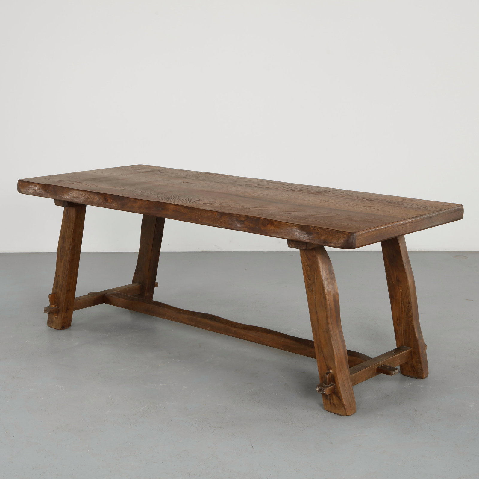 Olavi Hanninen, Brutalist Dining Table, 1960s: A powerful dining table executed in solid wood, featuring a thick top supported by bold trestle legs. The expressive grain and sculptural construction emphasize the raw beauty of the material. A stunn