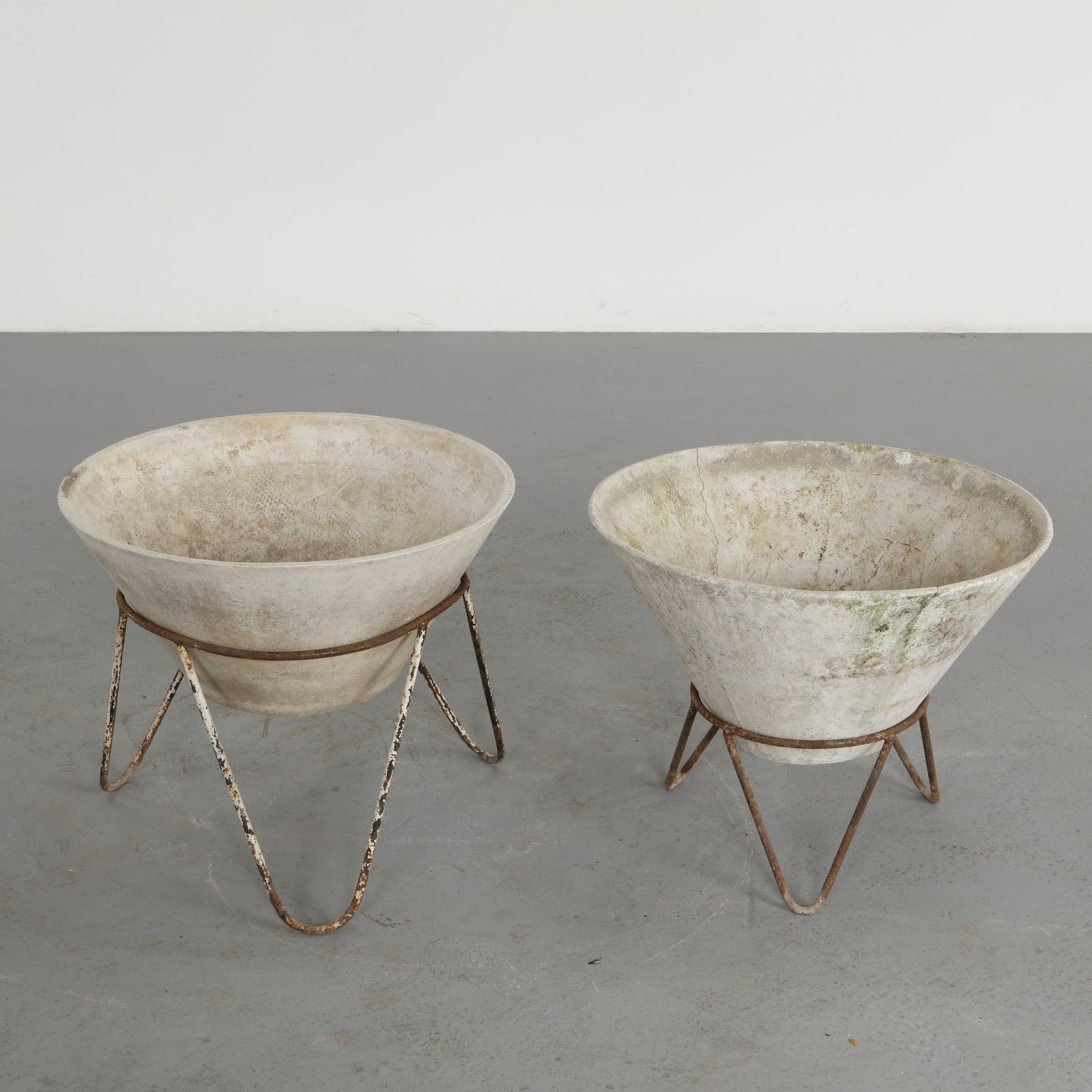 Willy Guhl, Pair Conical Planters on Stands, 1960s: Iconic Willy Guhl silhouettes in compact form, these conical planters rest atop minimalistic metal stands, weathered yet timeless. 1: Height: 19 in. Diameter: 22 in.Â 2: Height: 18 in. Diameter: 22.2