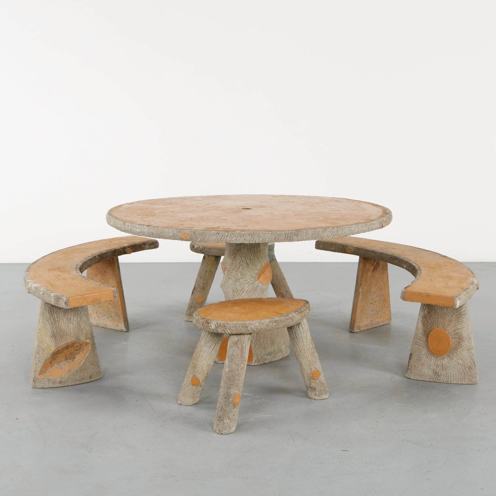 Faux Bois Outdoor Concrete Dining Set, 1960s: Crafted in molded concrete imitating natural wood grain, this outdoor dining set exemplifies the enduring appeal of faux bois garden furniture. The textured surfaces and organic silhouettes evoke rust