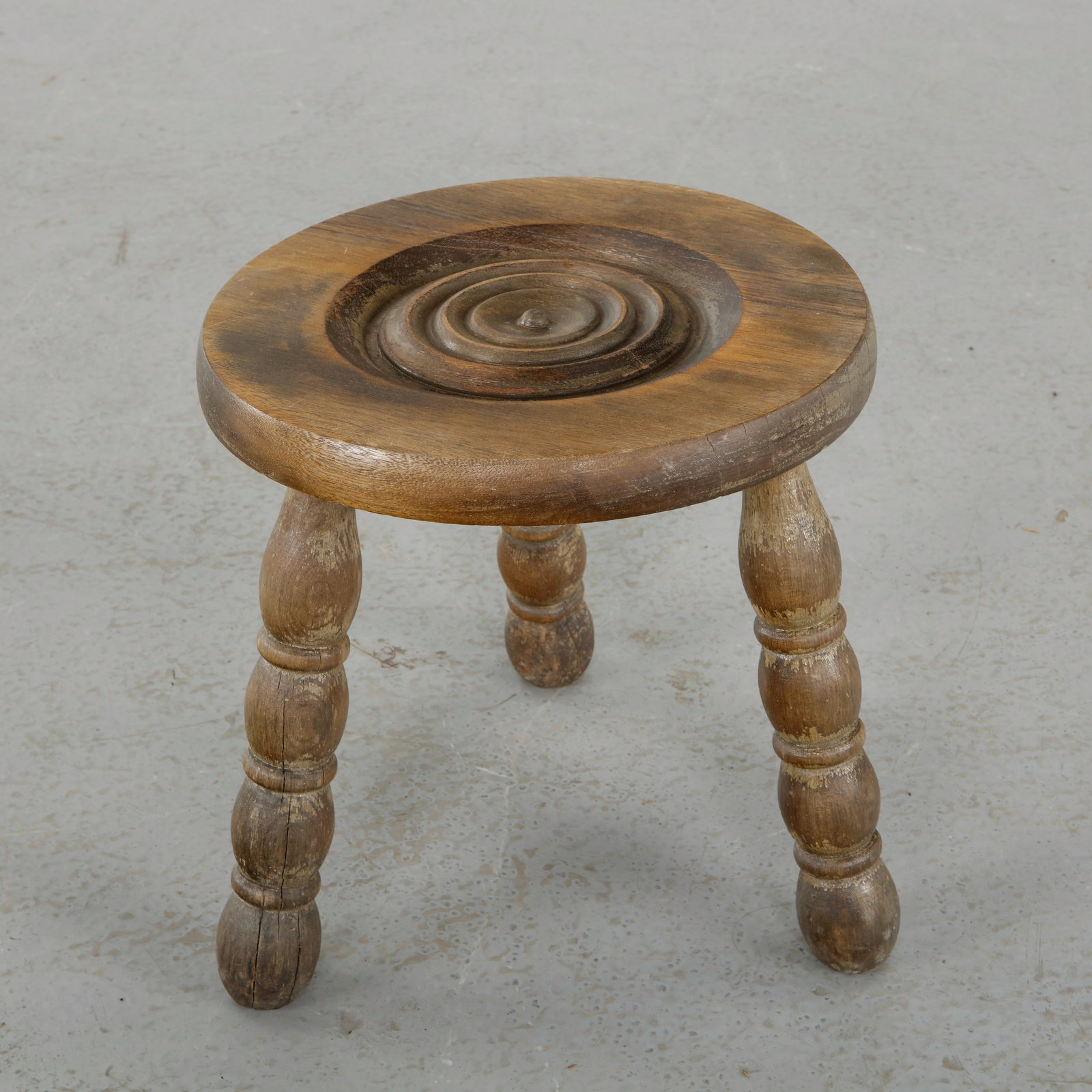 Charles Dudouyt, Wood Stool, 1950s: Characteristic stool in carved wood with sculpted legs and a thick circular seat, illustrating Dudouyt mastery of material and form. A refined example of French artisanal modernism Height: 12 in. Diam