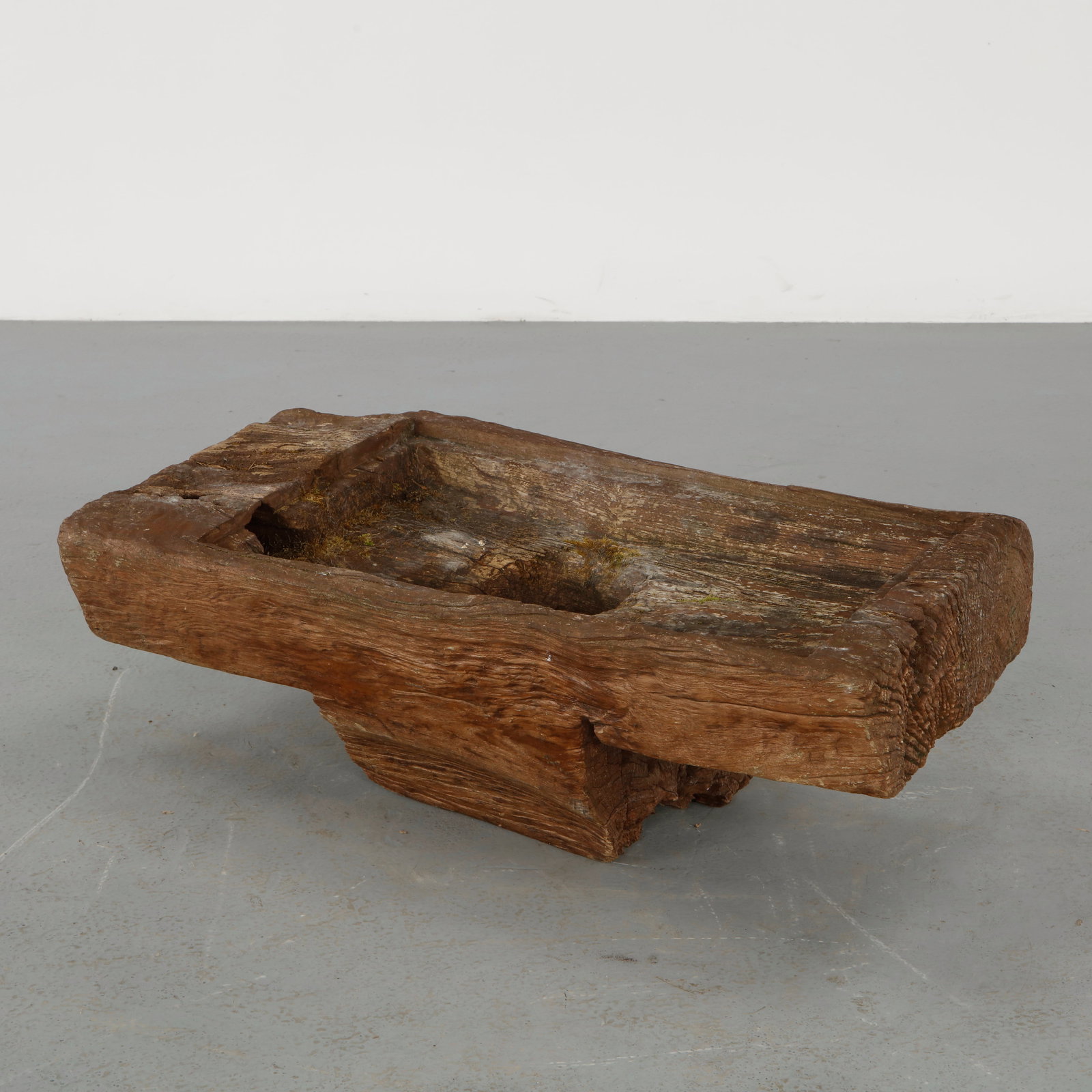 Brutalist, Hand Carved Solid Wood Planter, 1960s: Carved from a single block of wood, presenting a raw organic form with pronounced grain and aged patina. A sculptural piece rooted in material expression. Height: 14 in. Width: 38.5 in. Depth: 19 in.