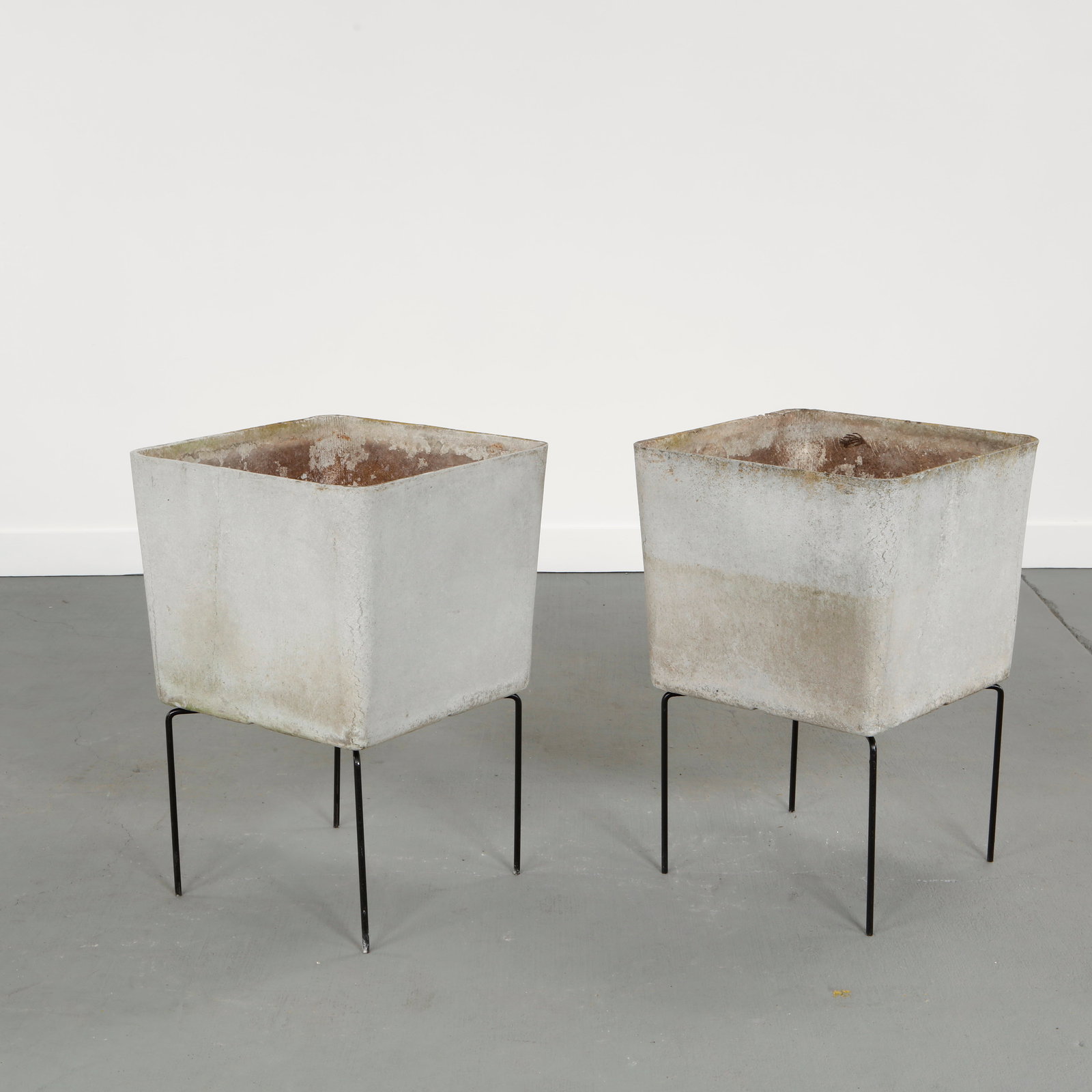 Willy Guhl, Pair of Square Planters on Stands, 1960s: Striking pair of square fiber cement planters elevated on slender metal stands, offering a refined balance between geometric rigor and lightness of presentation. Height: 28 in. Length: 19 in. Width: 1